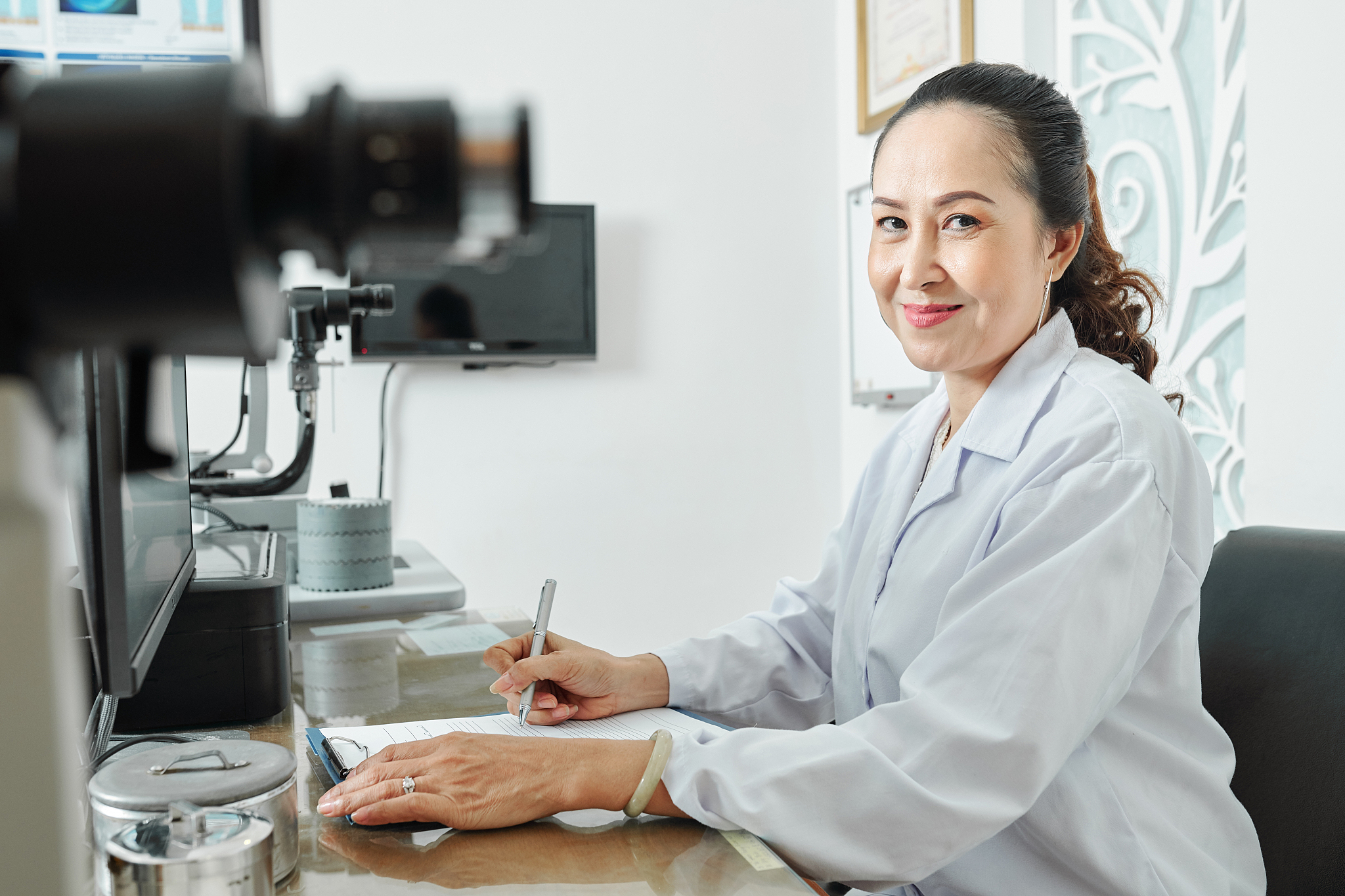 female optometrist at office