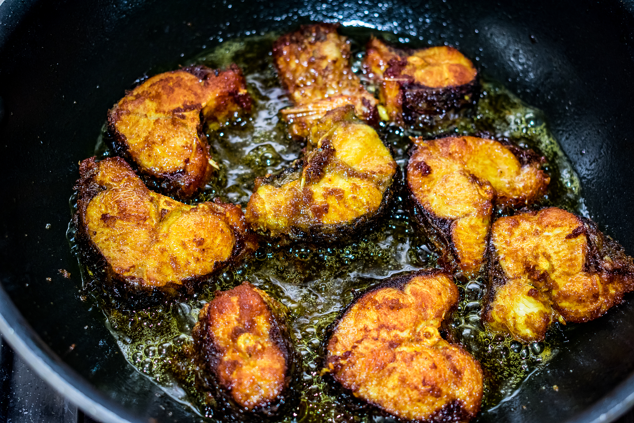 deep frying of cut fish  in low flame looking delicious.