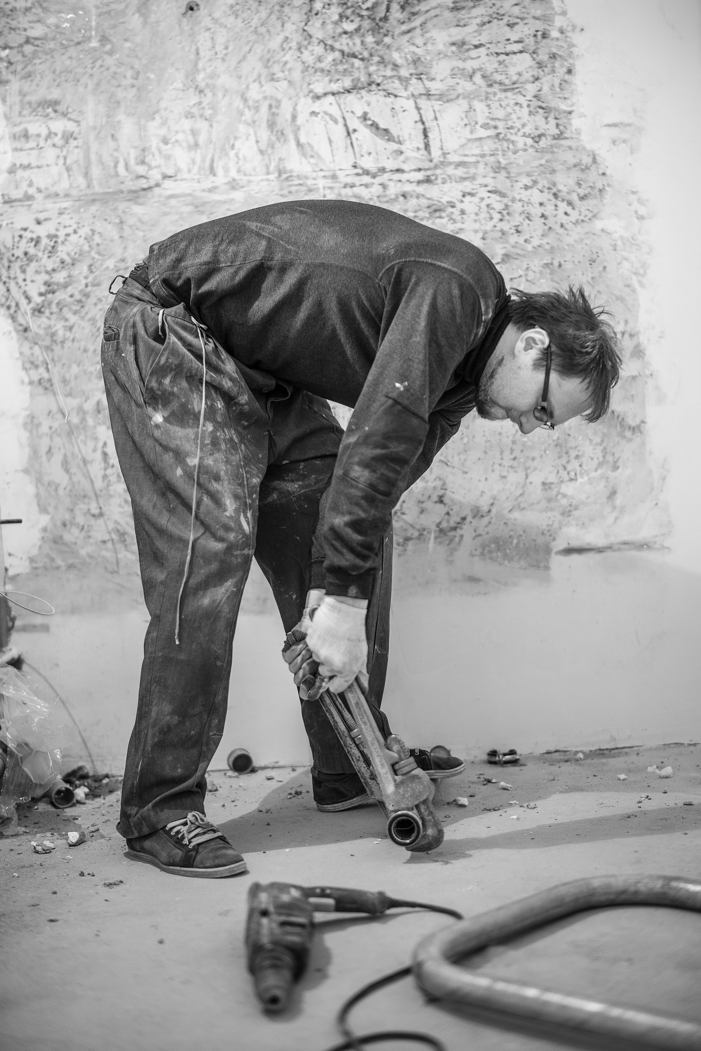 30 years old man, manual worker - plumber, working with pipes fo