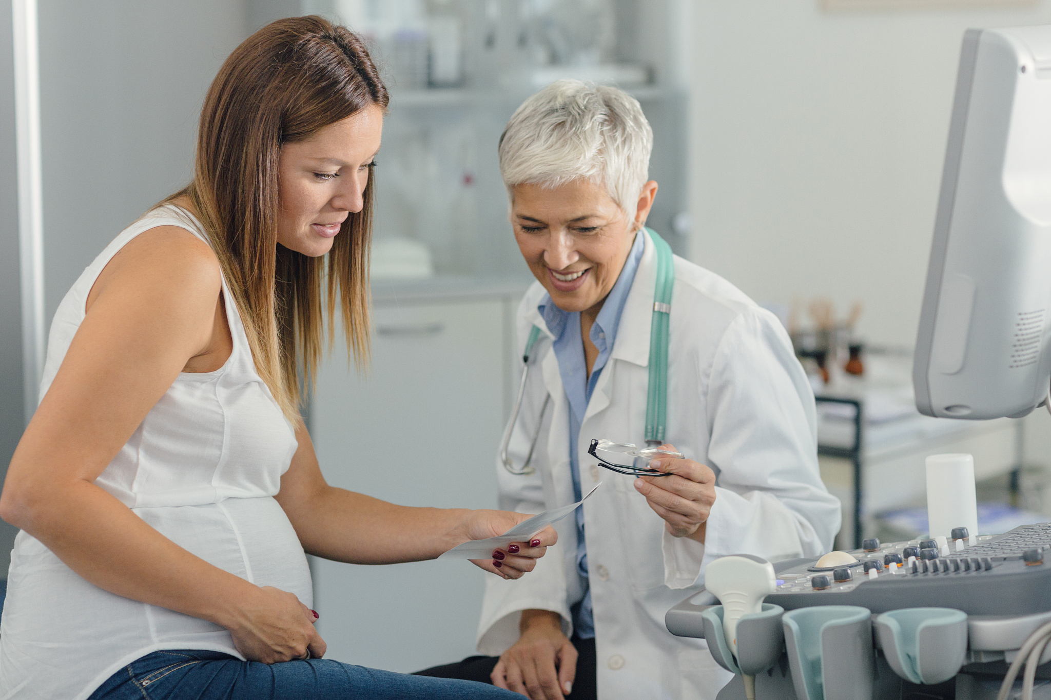 pregnant woman and female doctor in a consultation.