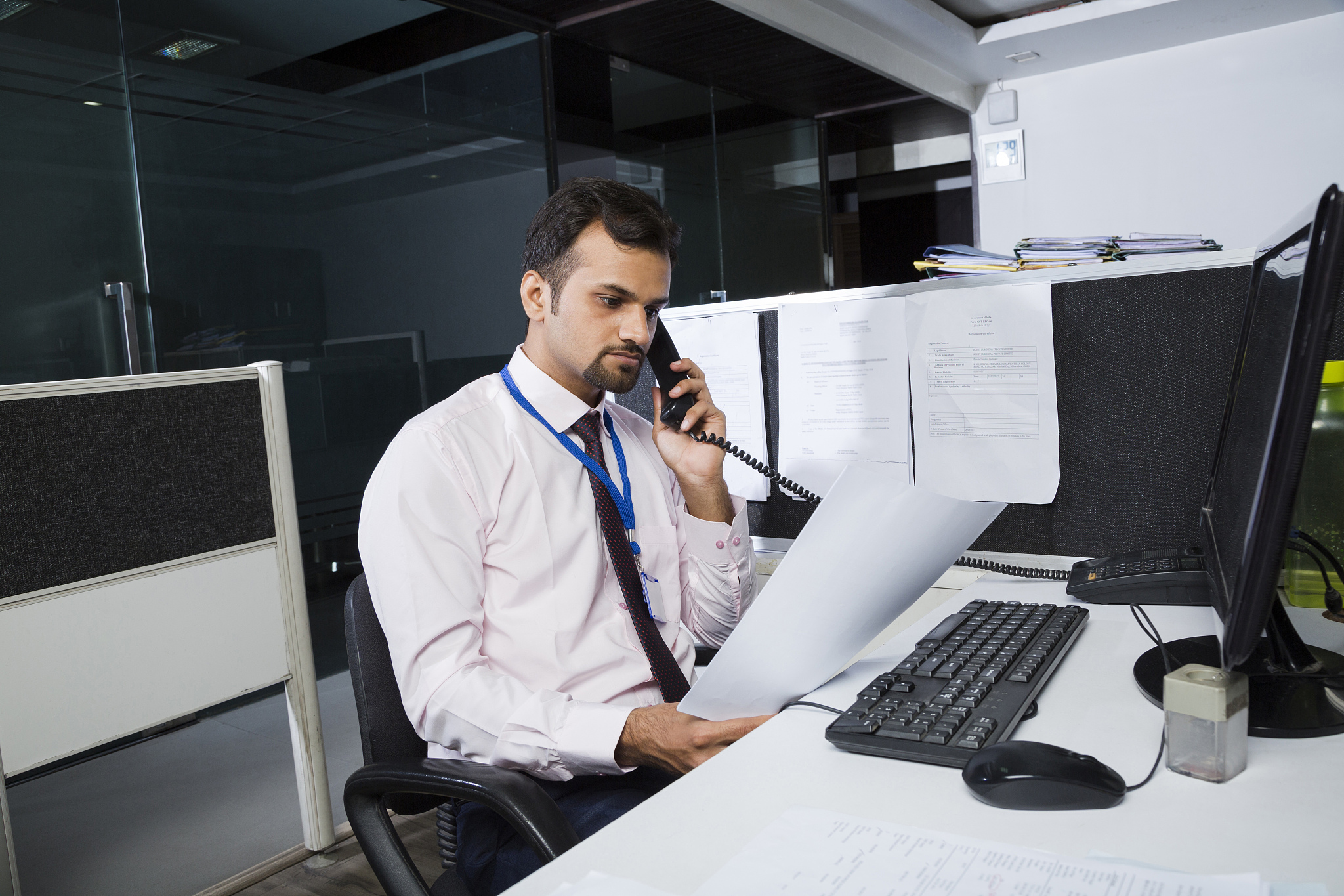 working late in a small office in barcelona - stock image