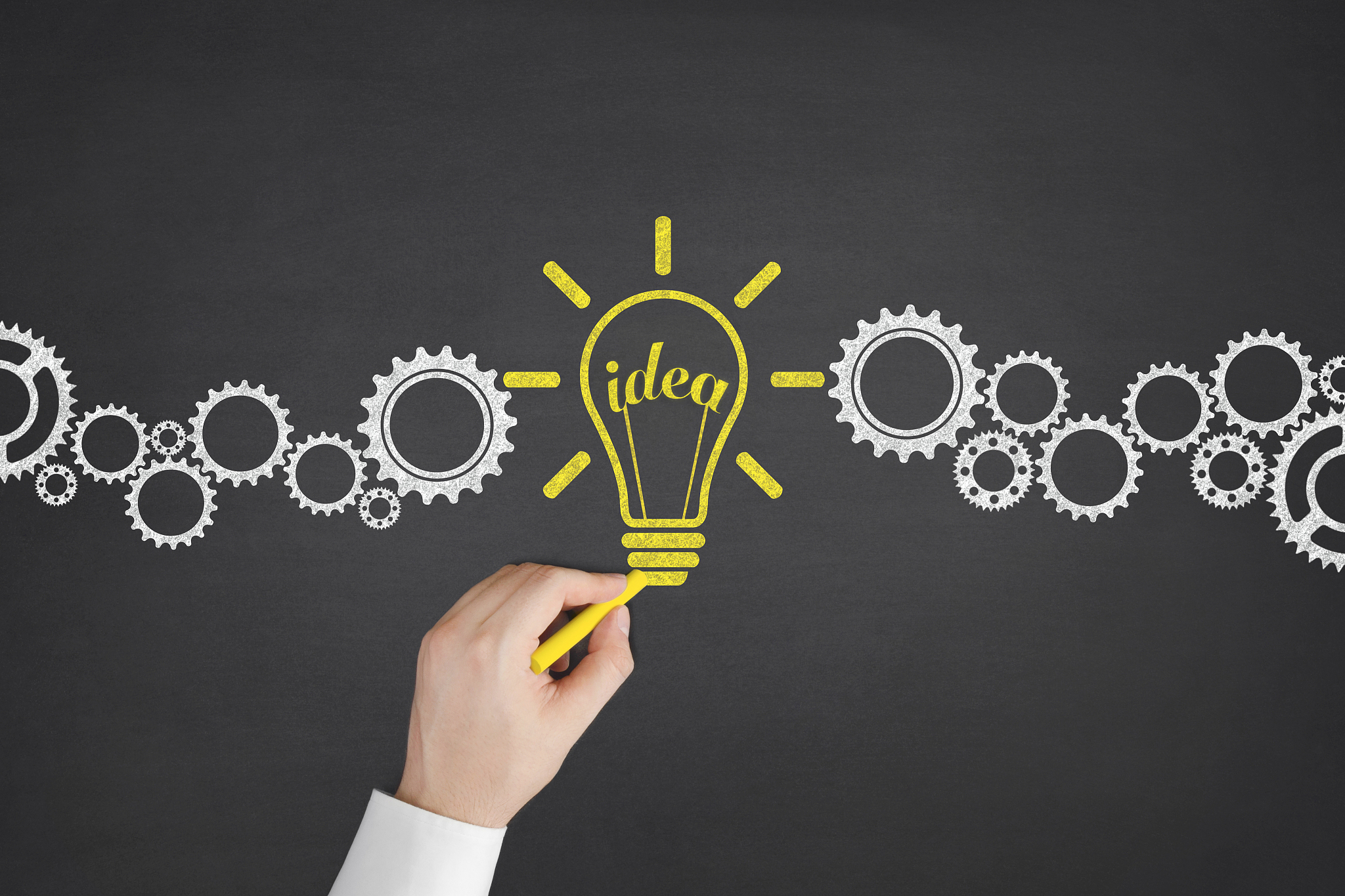 light bulb and new ideas concept on blackboard