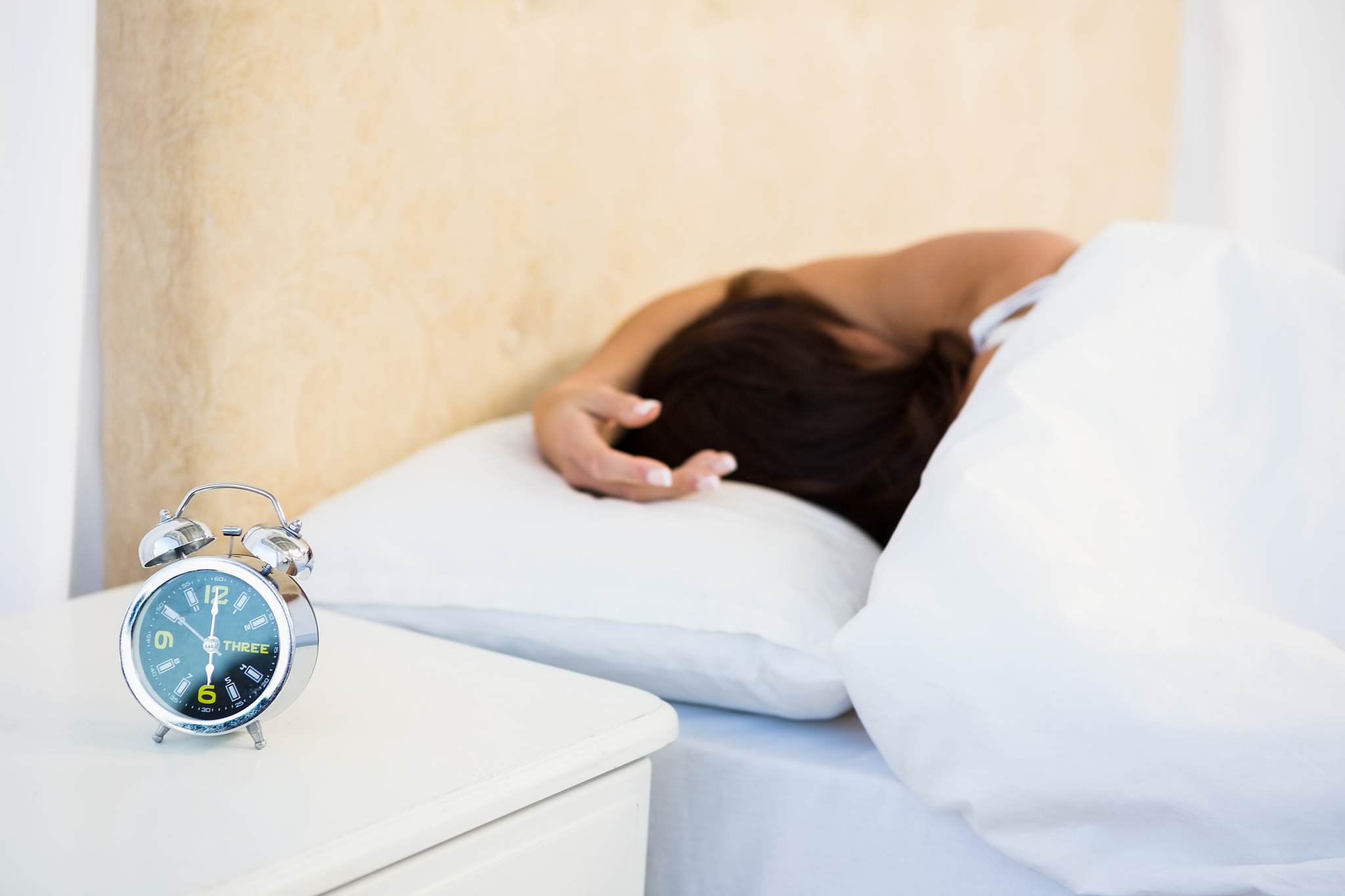 sleepy woman in her bed