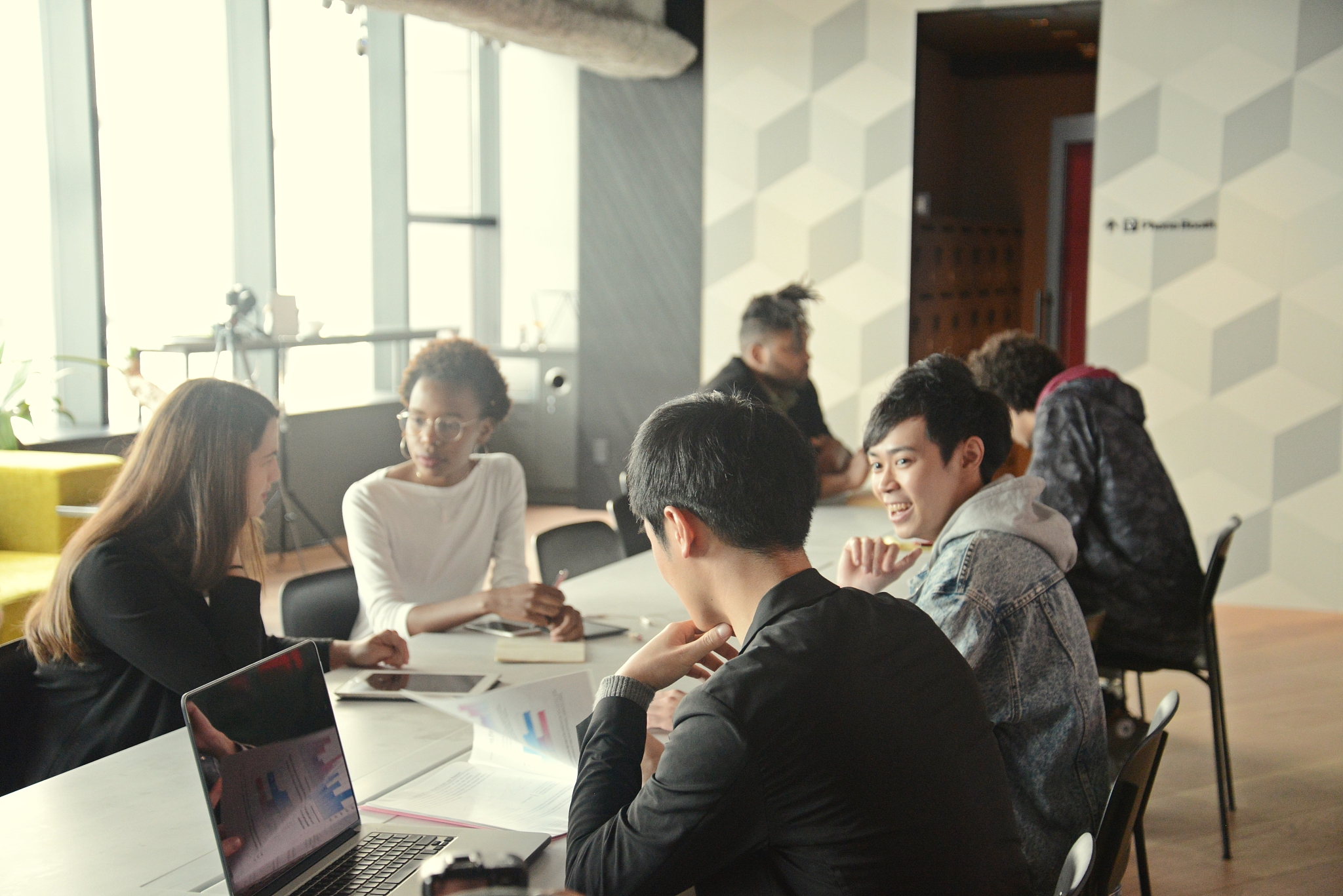 various ethnic young people working in a modern share office