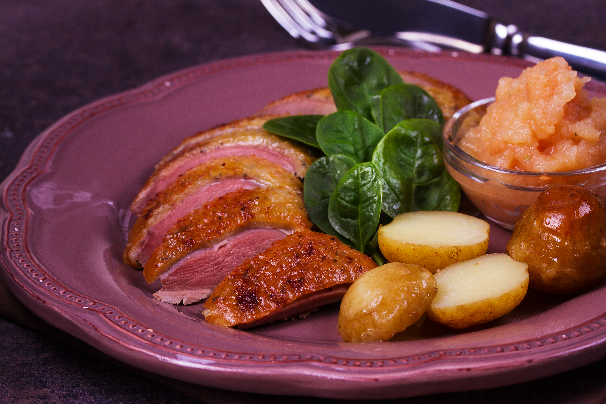 spiced slow roast duck, apple sauce, spinach and potato
