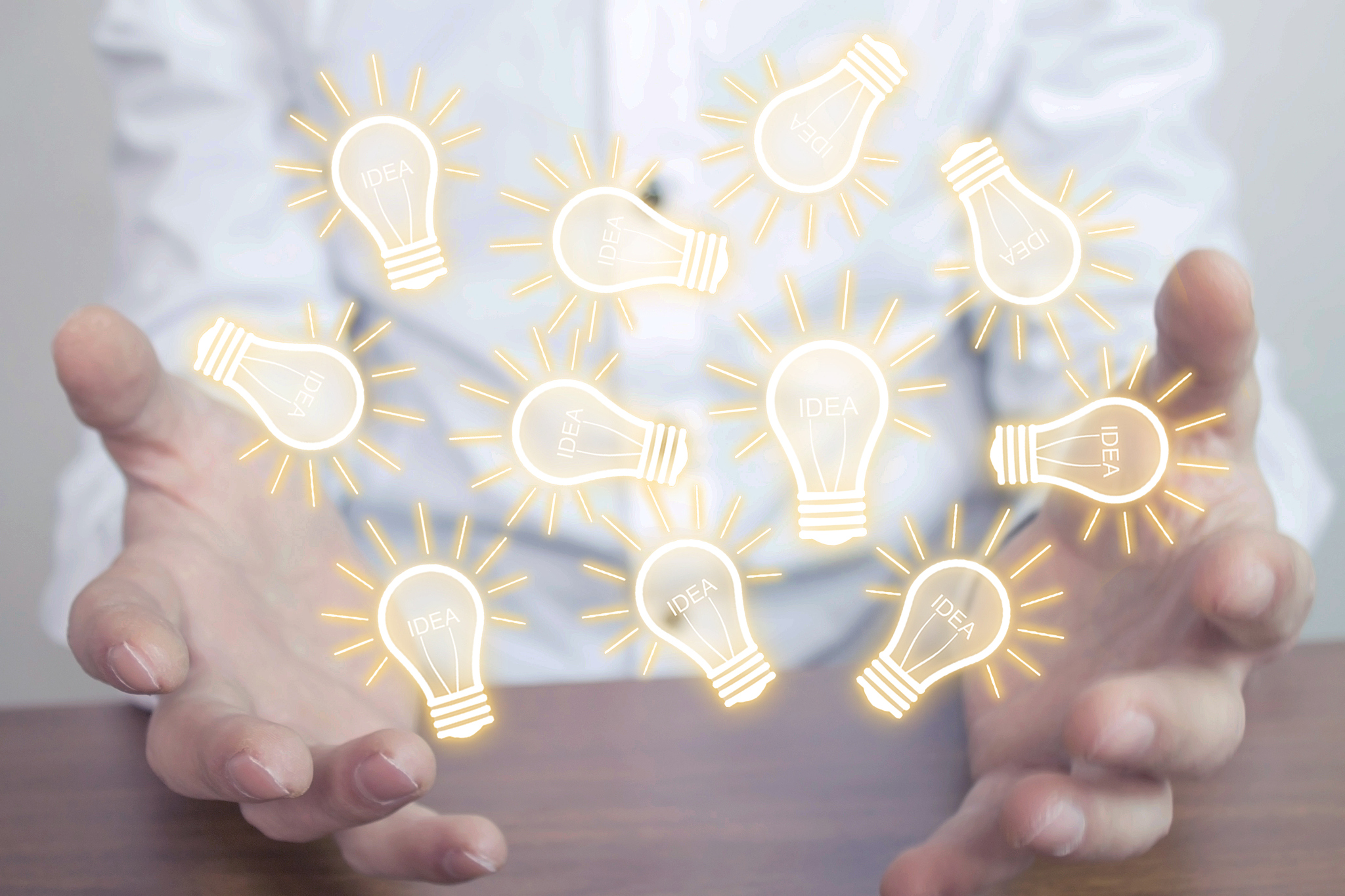 businessman holding light bulbs. concept of new idea