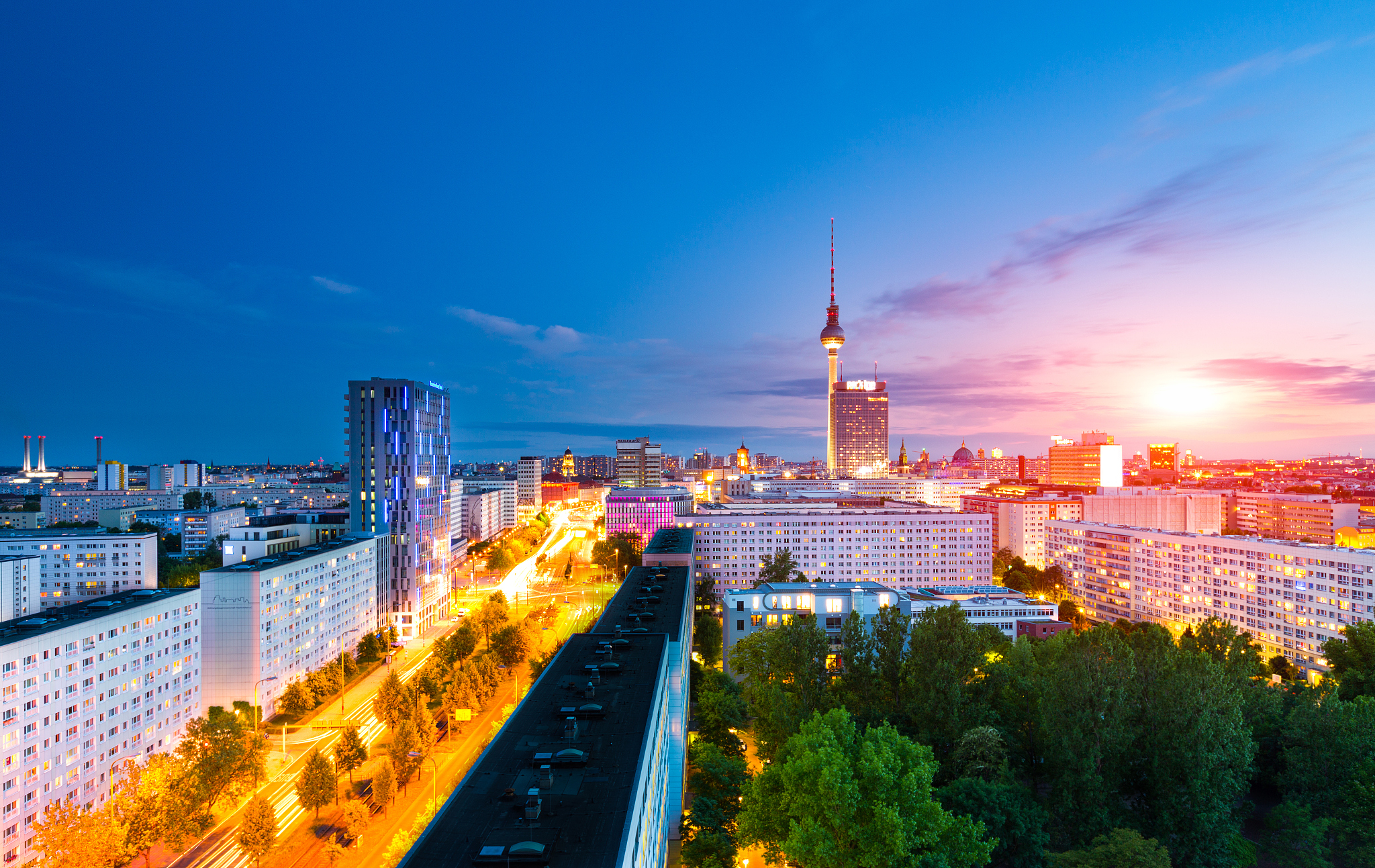berlin skyline cityscape with traffic and sunset