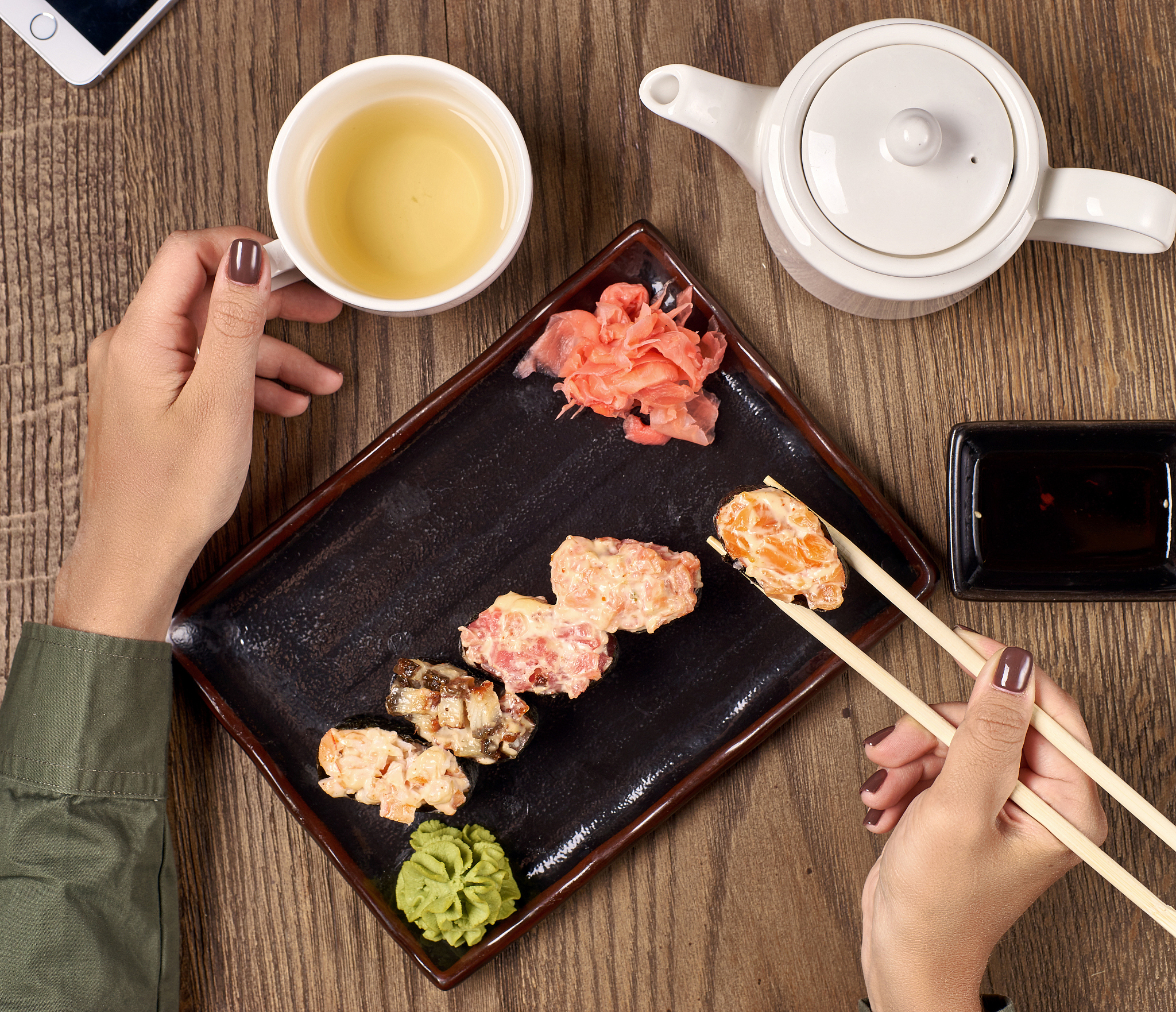 eating sushi with bamboo sticks