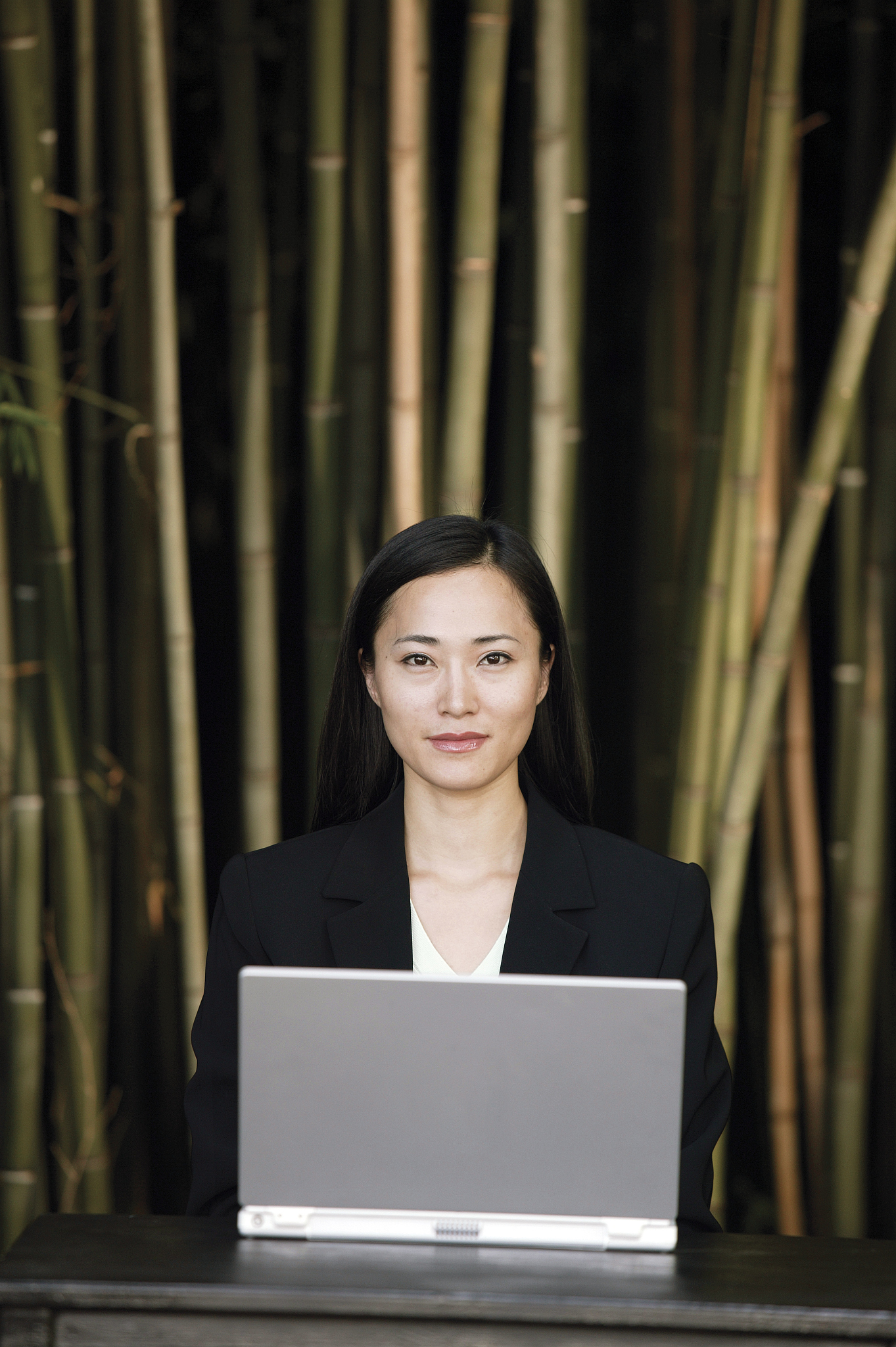 woman outside with laptop