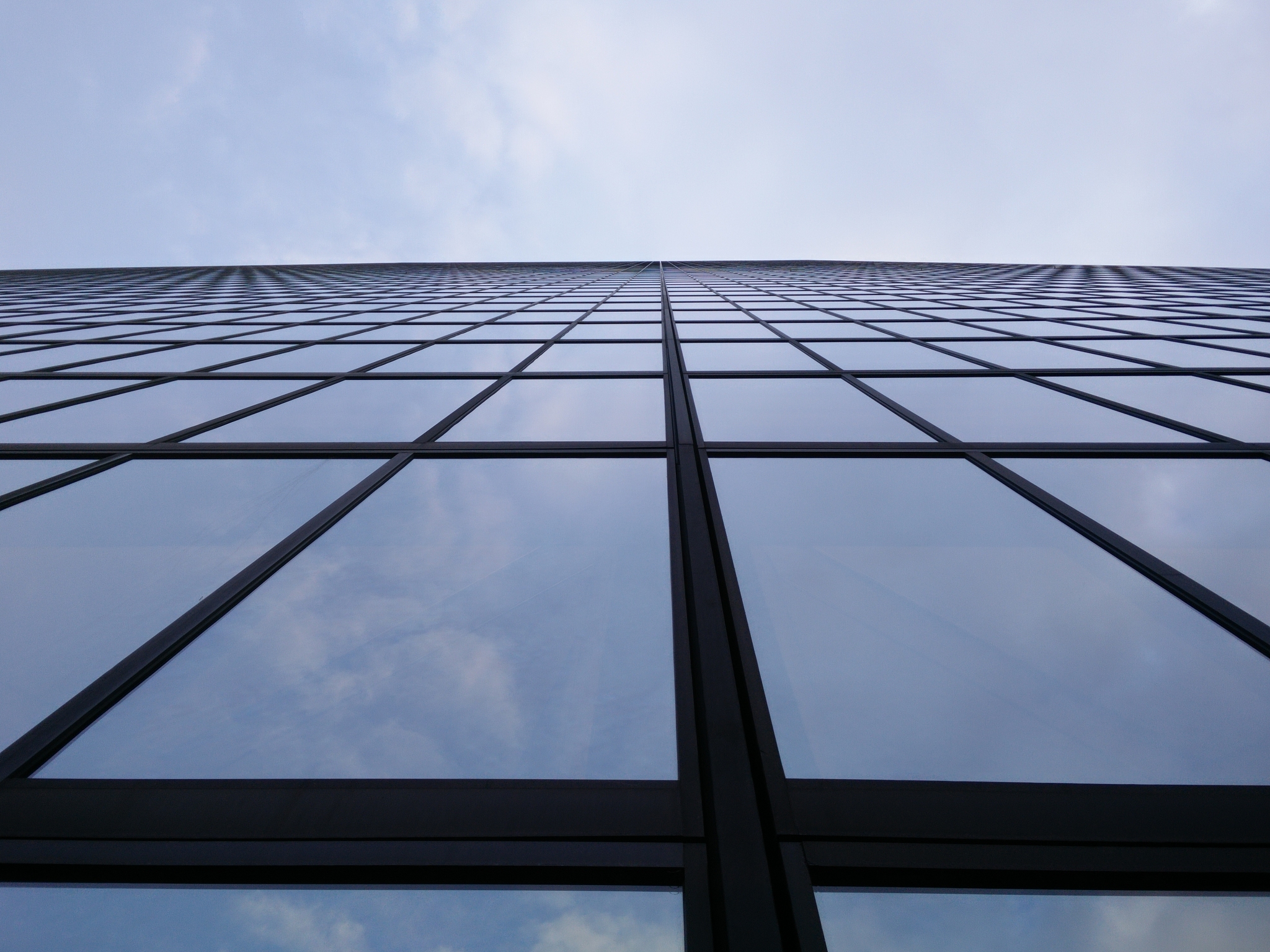 low angle view of skyscraper against sky