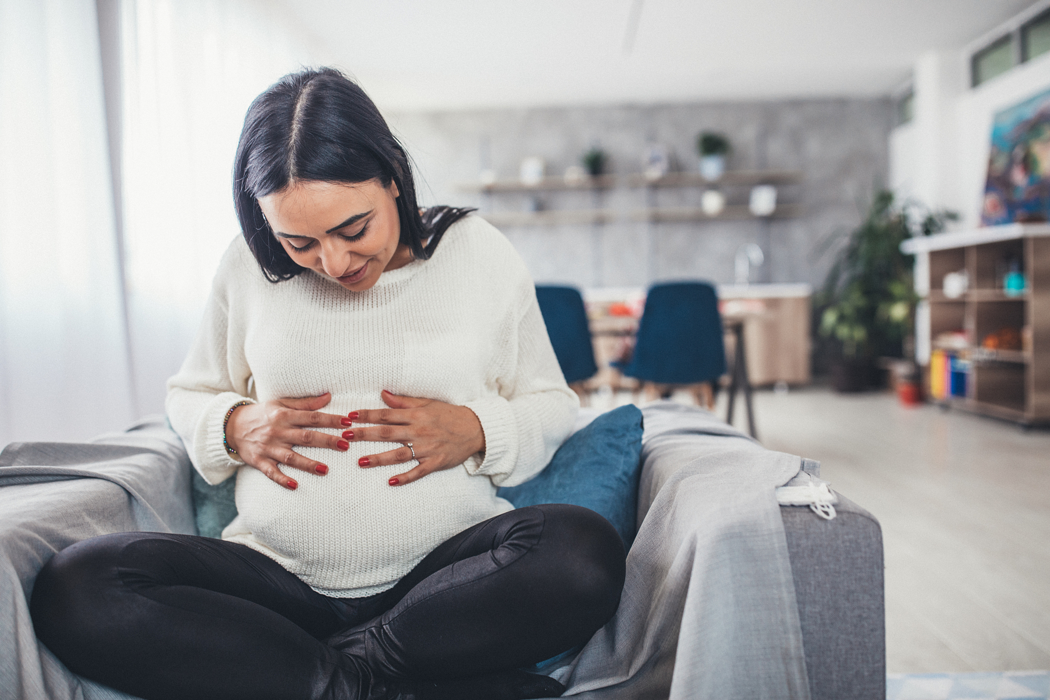 beautiful pregnant woman at home