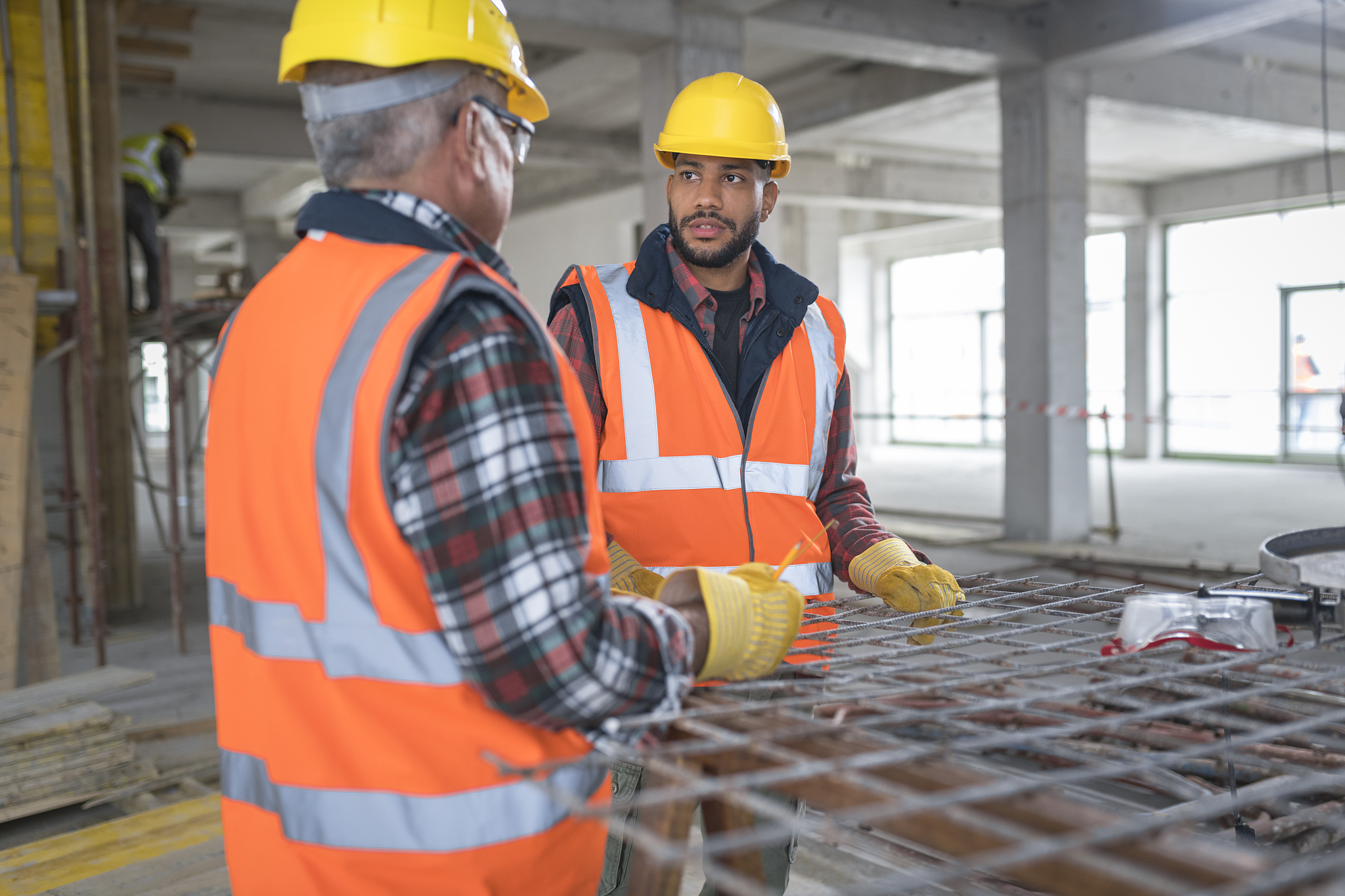 construction workers discussing at site