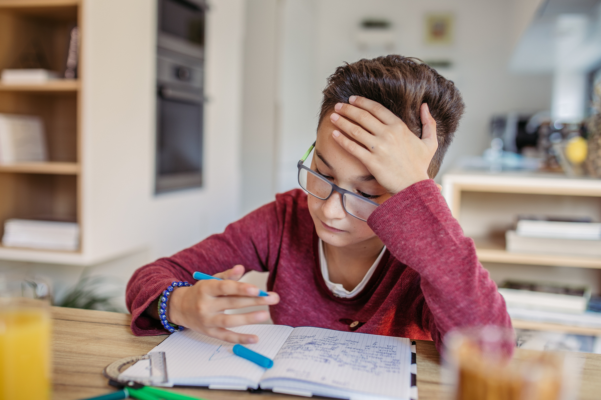 kid doing homework alone