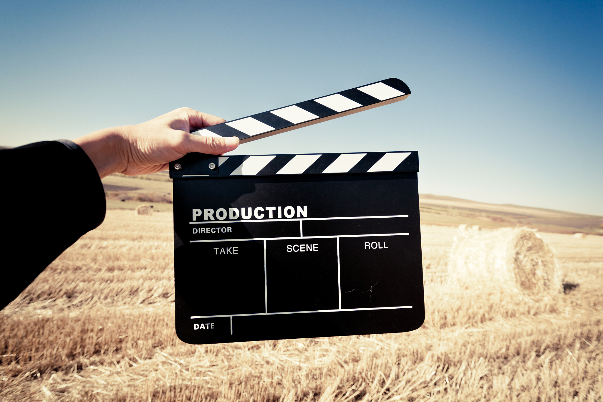 hands holding a movie clapboard