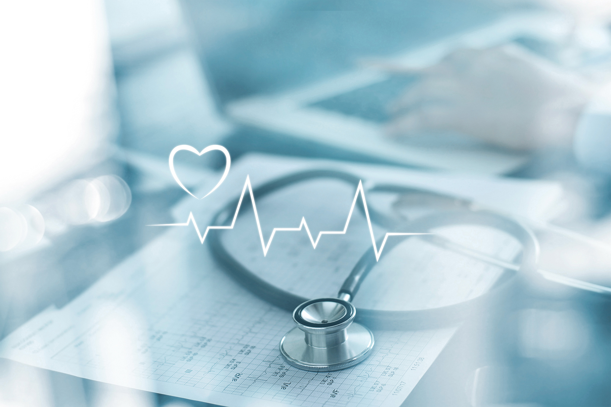 stethoscope with heart beat report and doctor analyzing checkup 