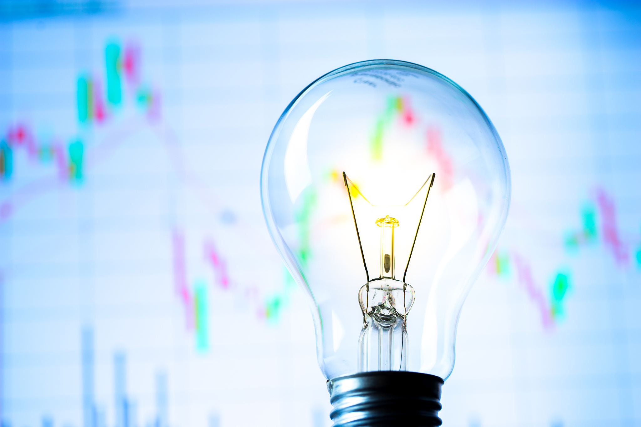 business success with stock graph and light bulb