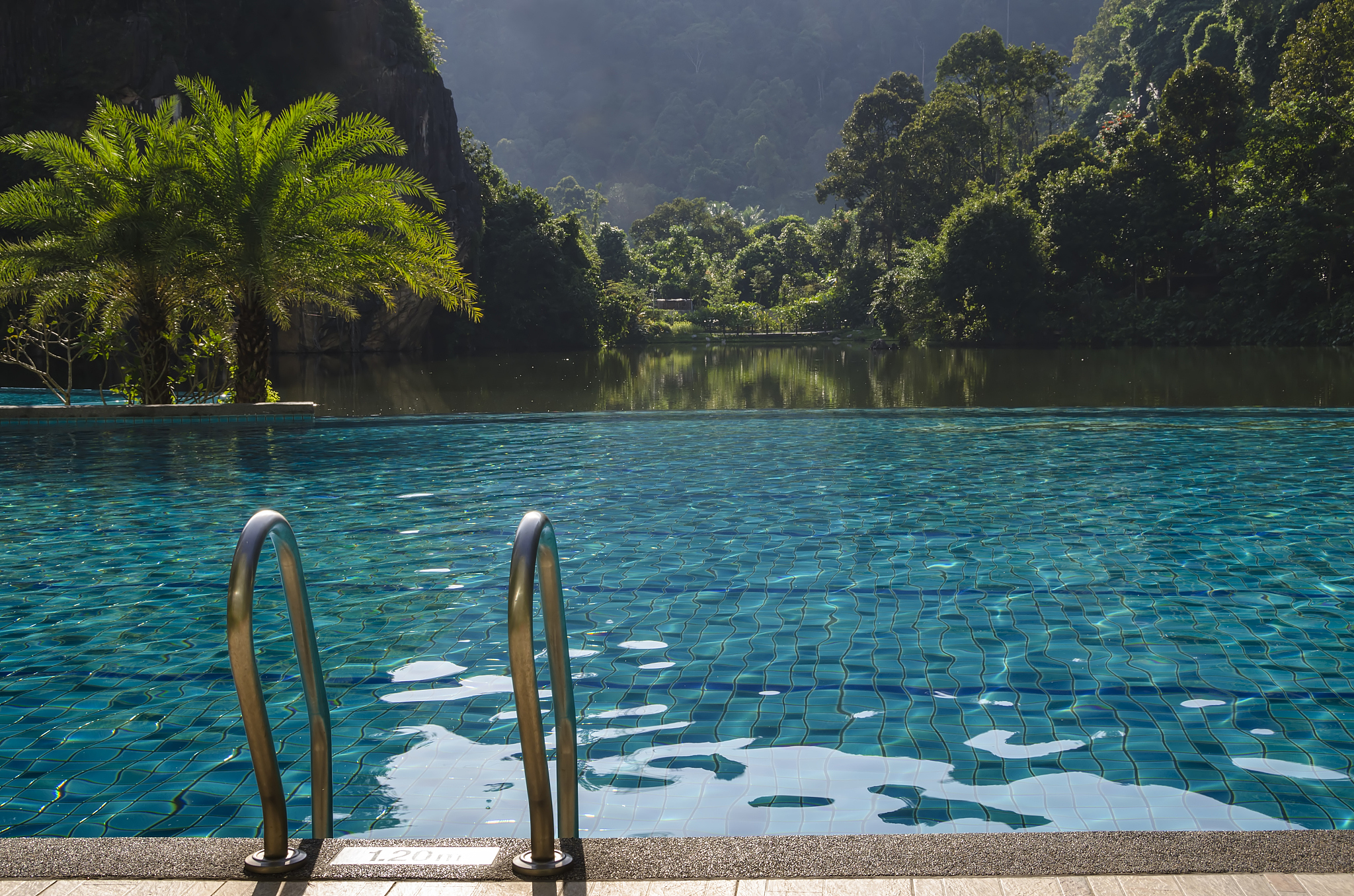 swimming pool beside lake