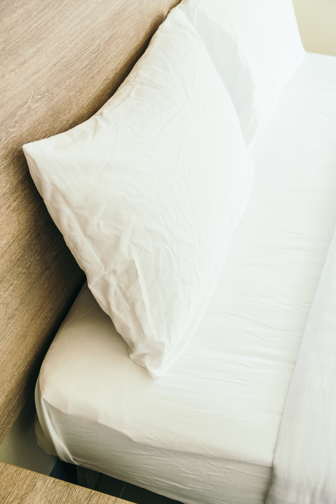 white pillow on bed