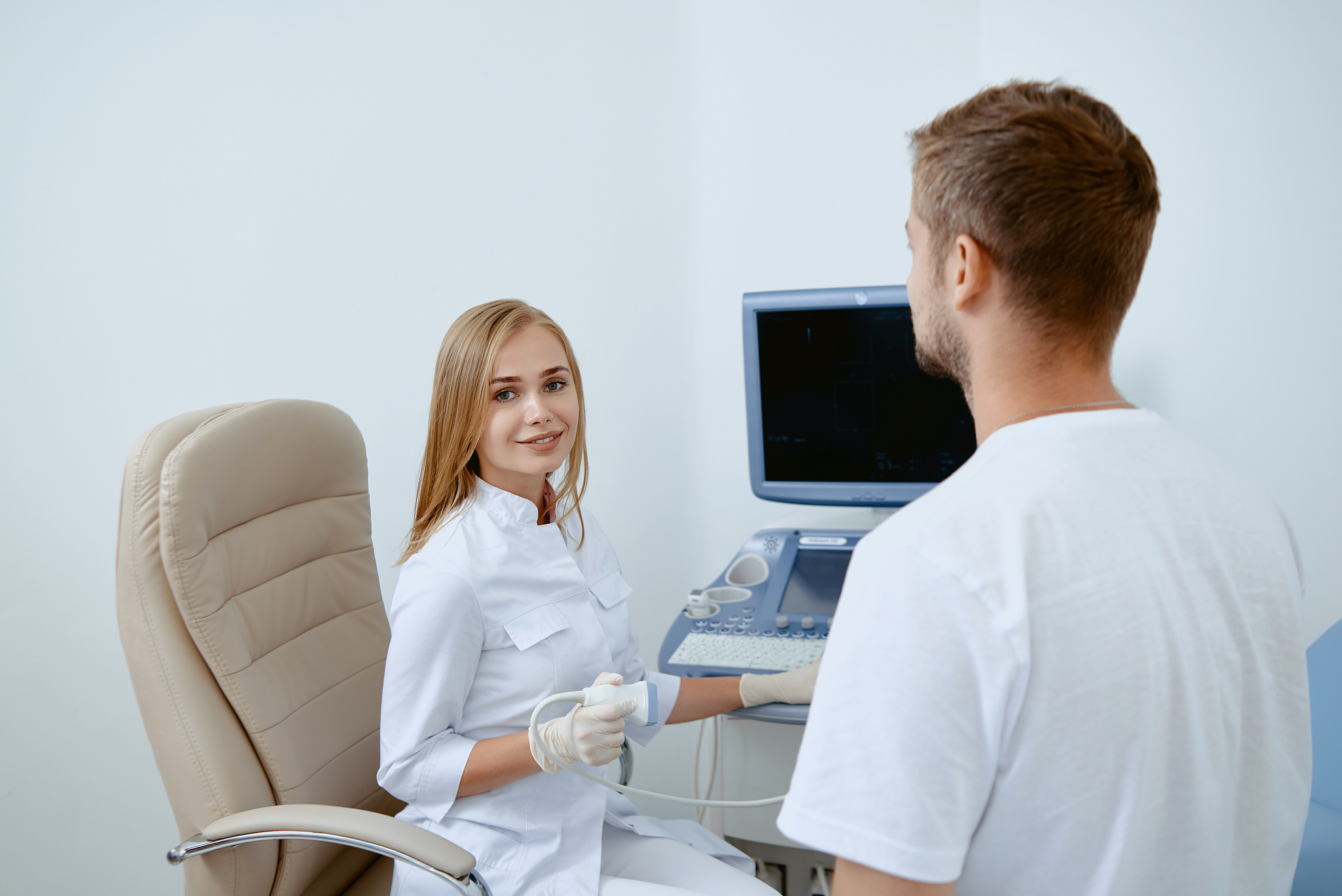 man and doctor talking after medical cosultation.