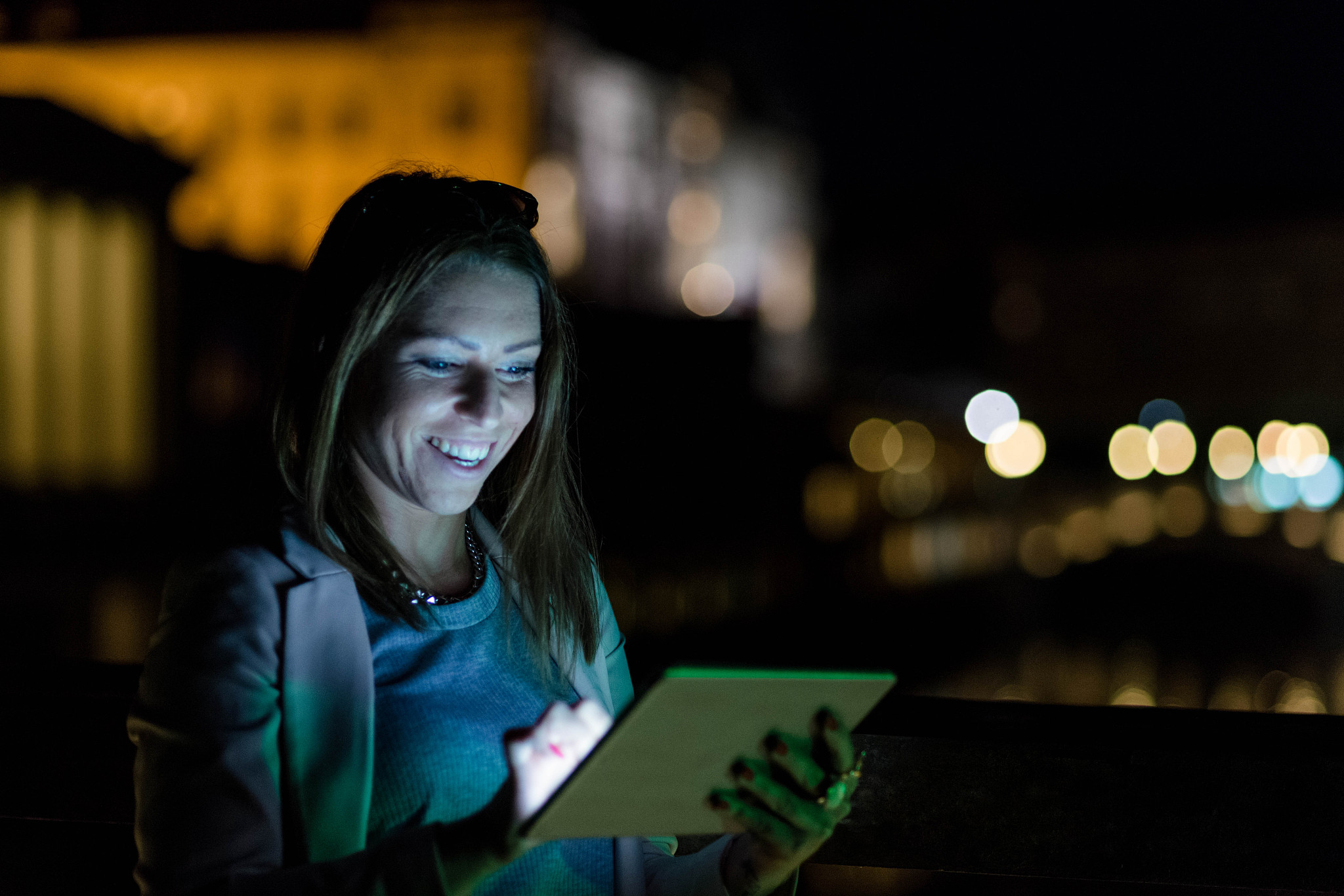 young woman with technology at night