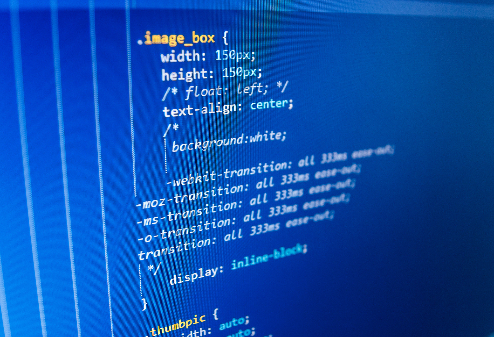 software developer programming code on computer