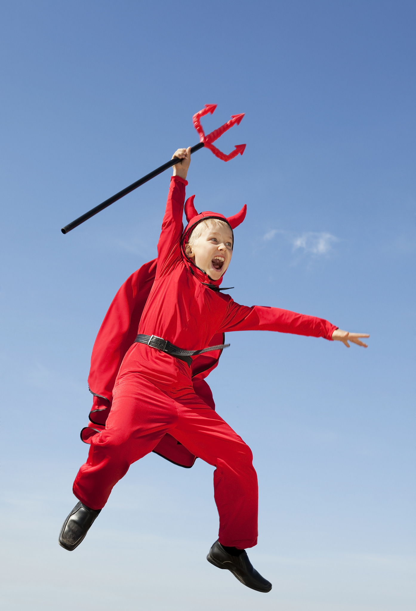 little red devil jumping with a trident.