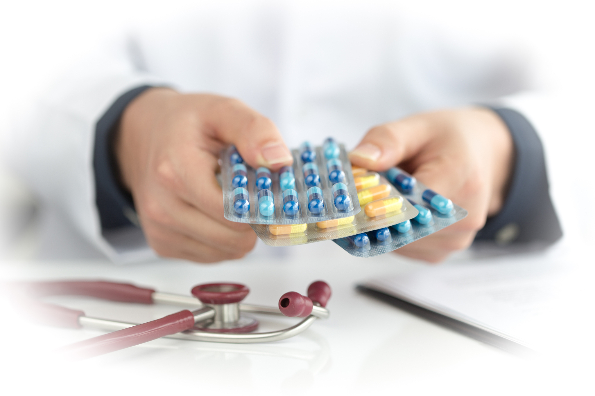 doctor's hands giving many medicines