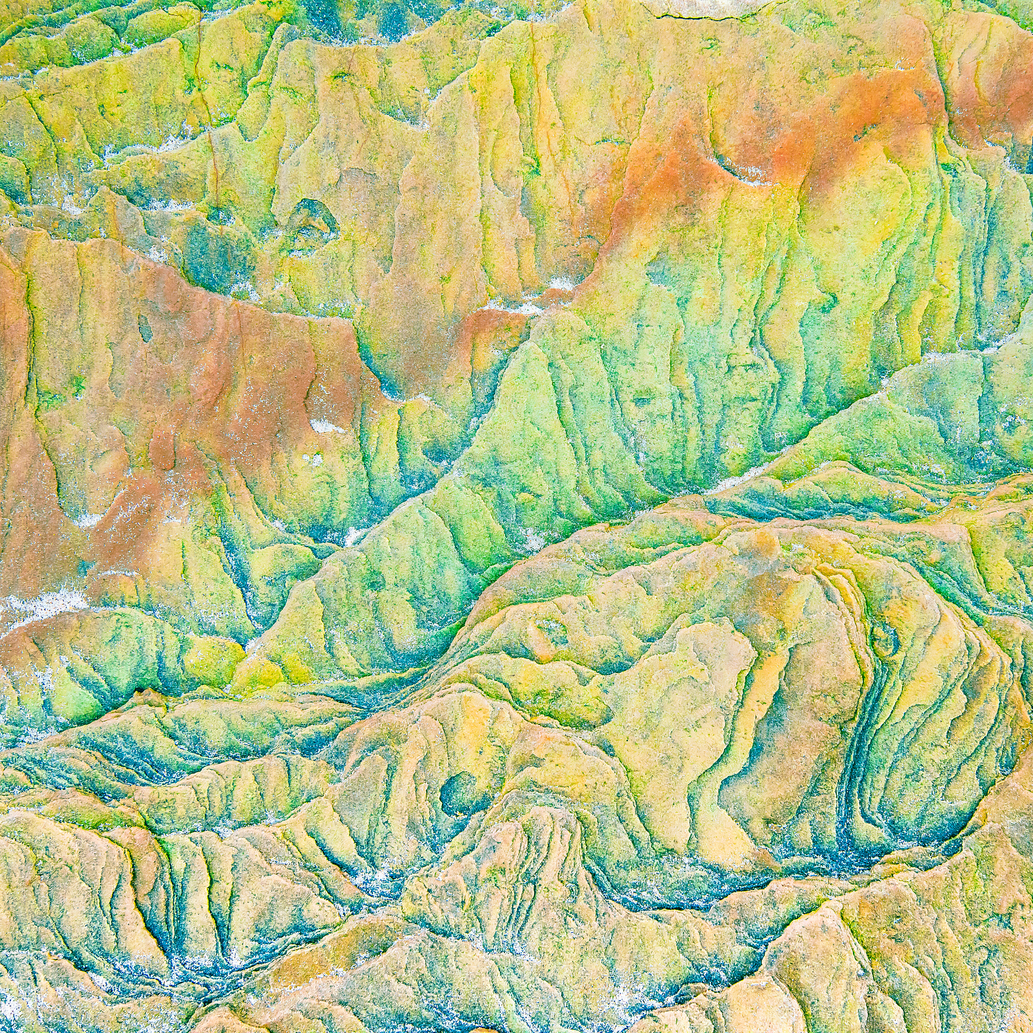 colourful mosaics or rocks - layered sedimentary minerals expose