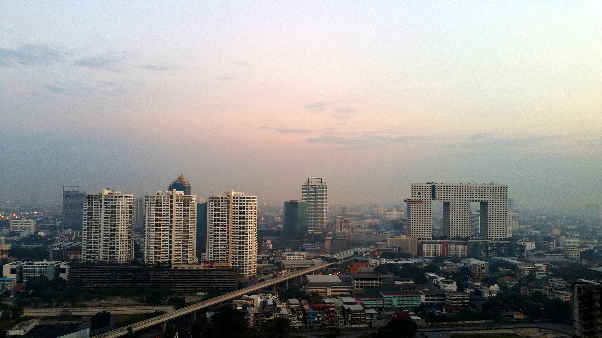 high angle view of modern buildings in city against sky