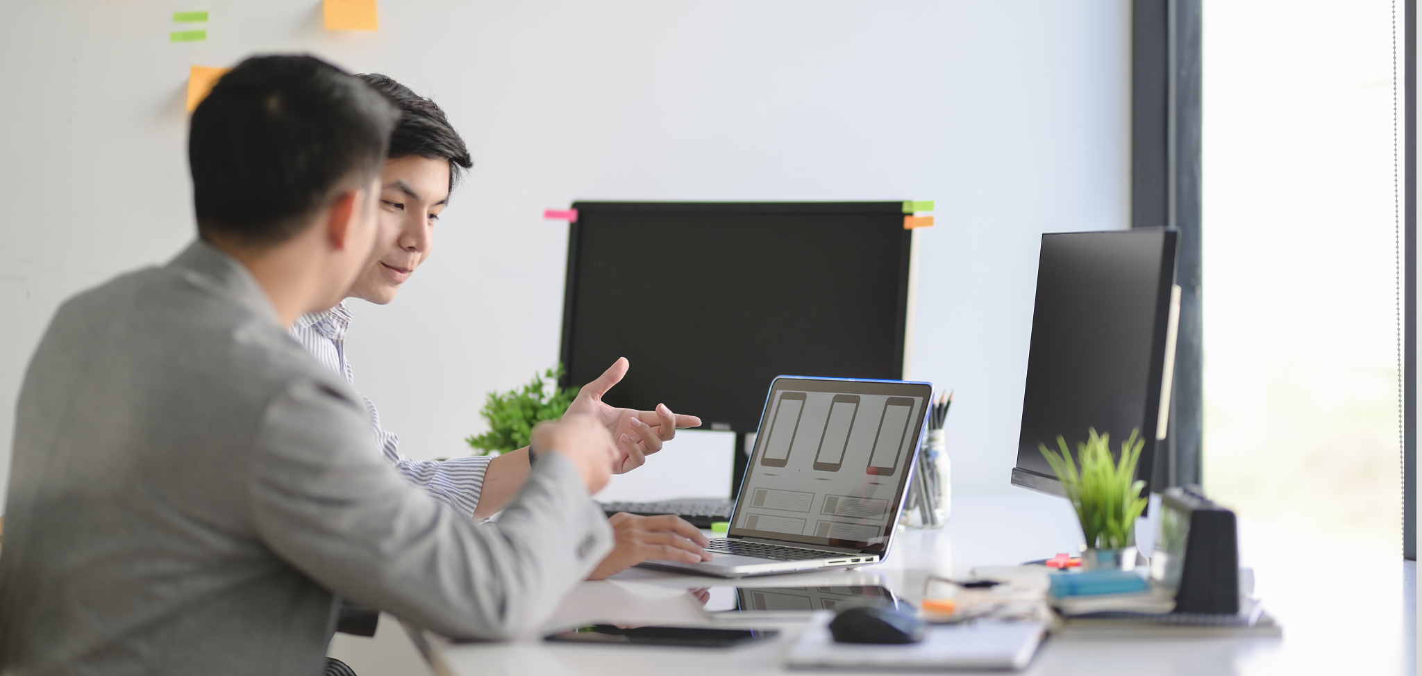 group of professional ux graphic designer working on smartphone 