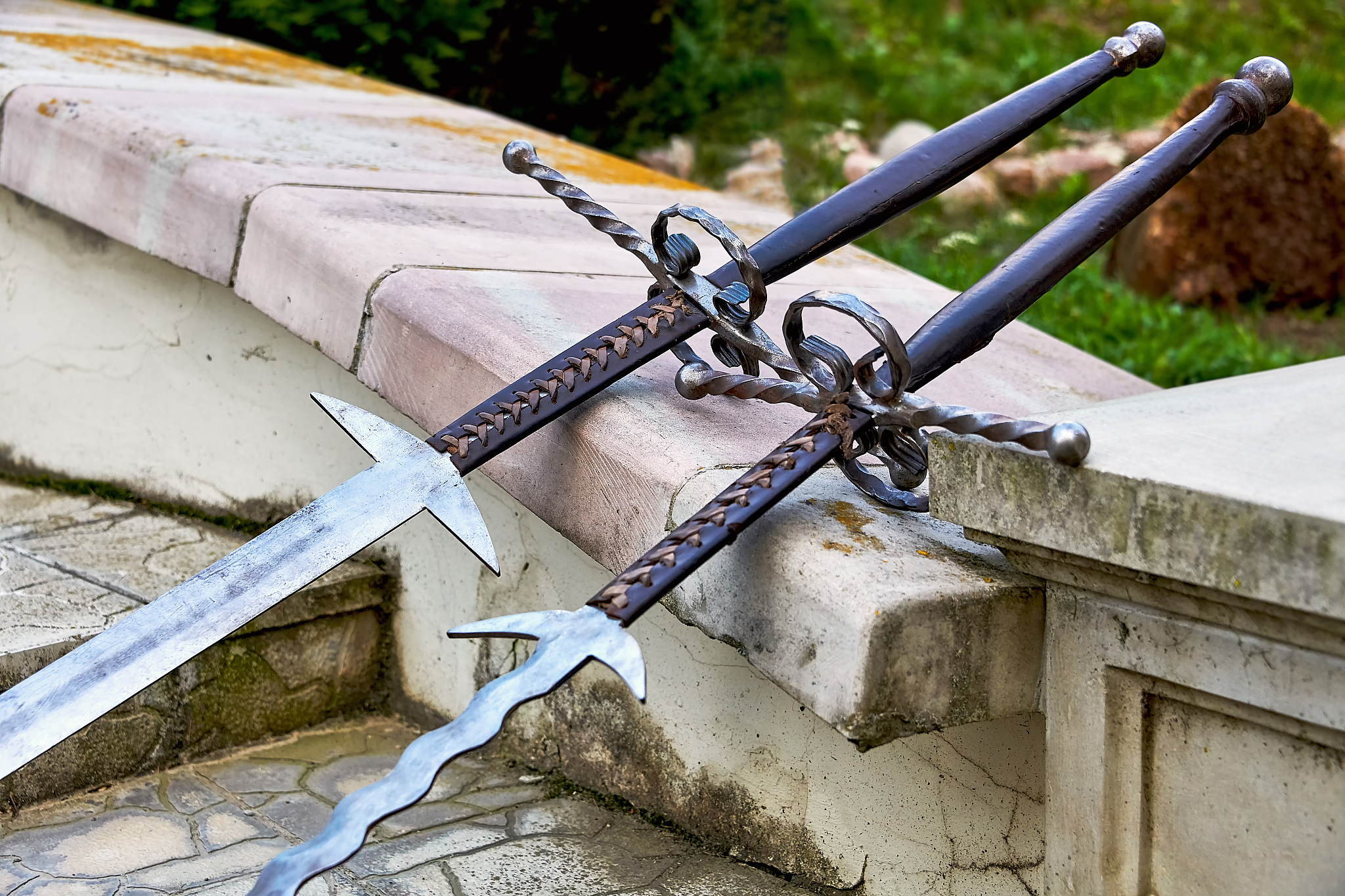 two large antique two-handed swords. the sword is a weapon of me