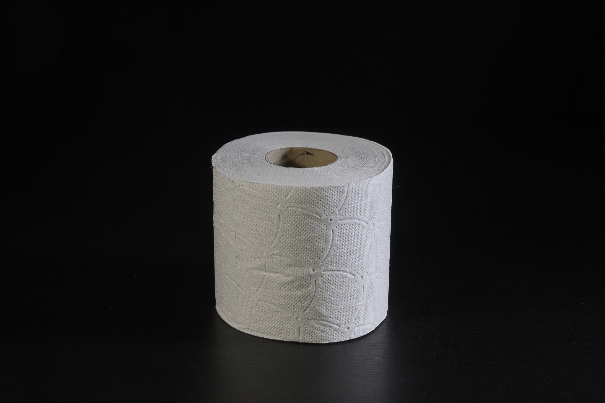 close up of a roll of hygienic paper on a table.