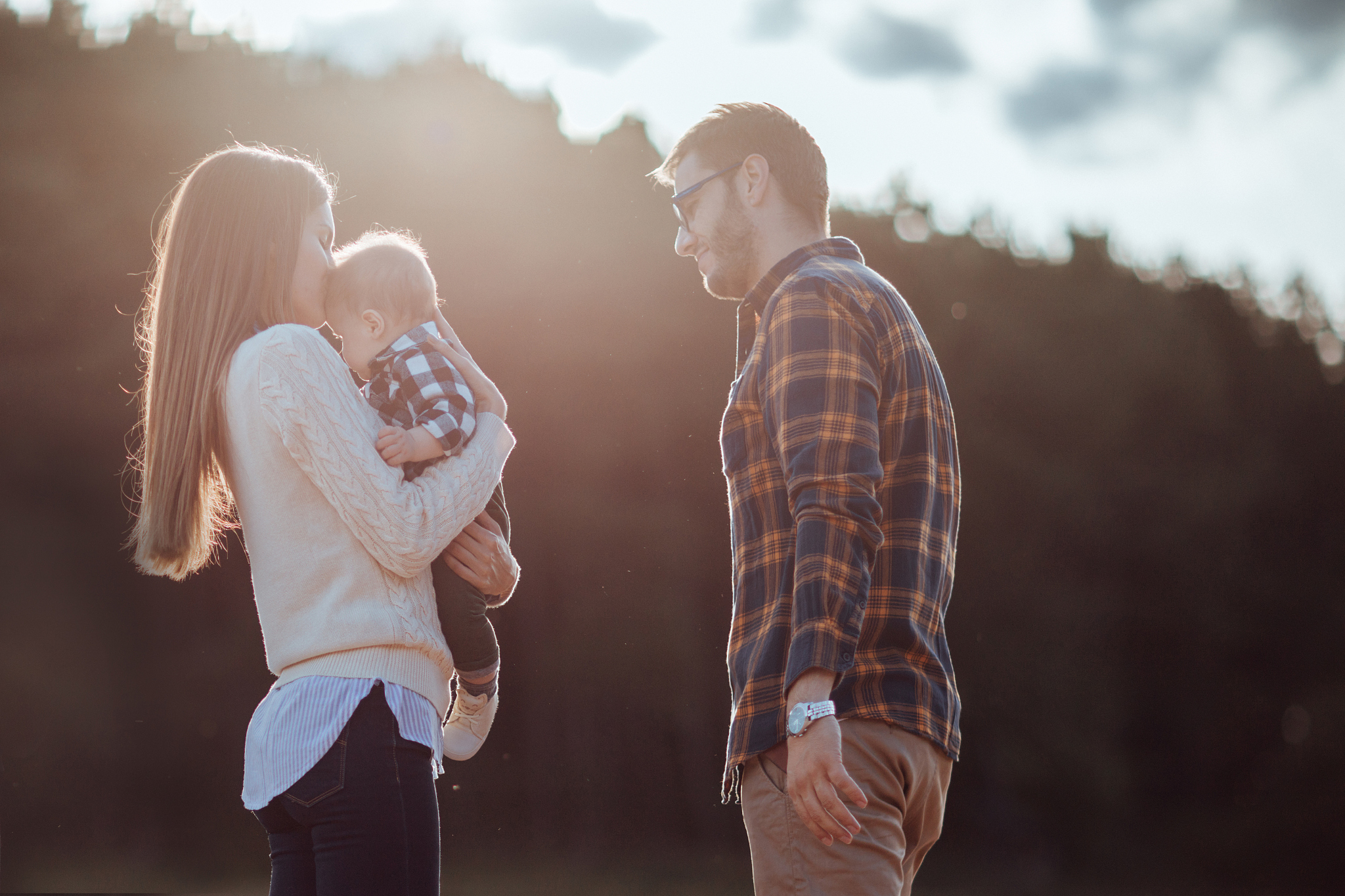 happy little family enjoying autumn day in forest