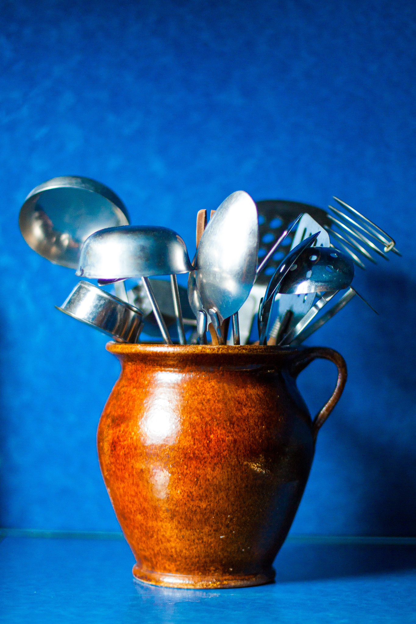 kitchen utensils on blue background