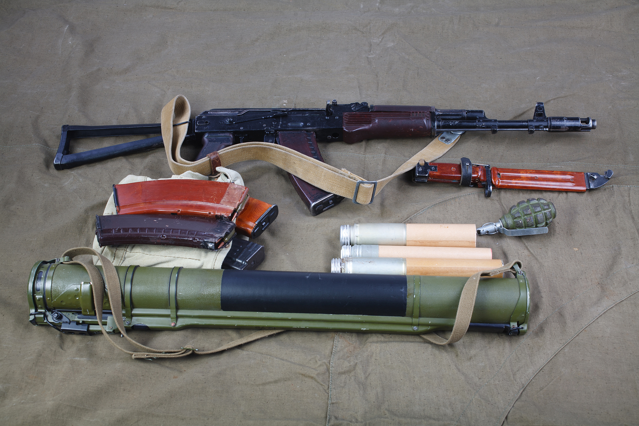 kalashnikov ak 74 with ammunitions on canvas