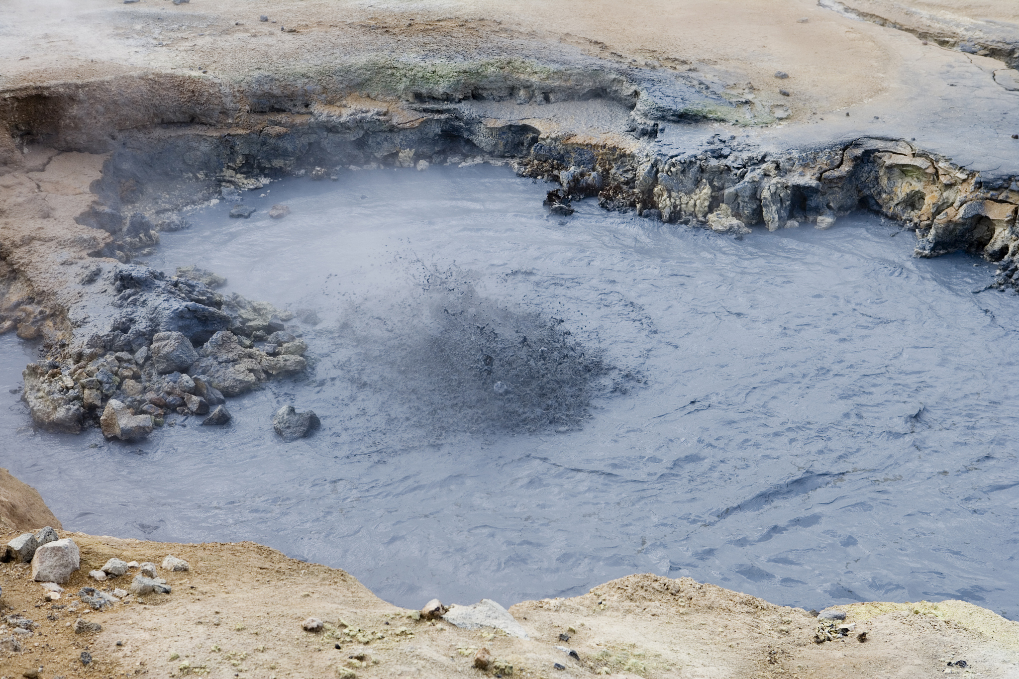 boiling mudpool at krafla geothermal area.