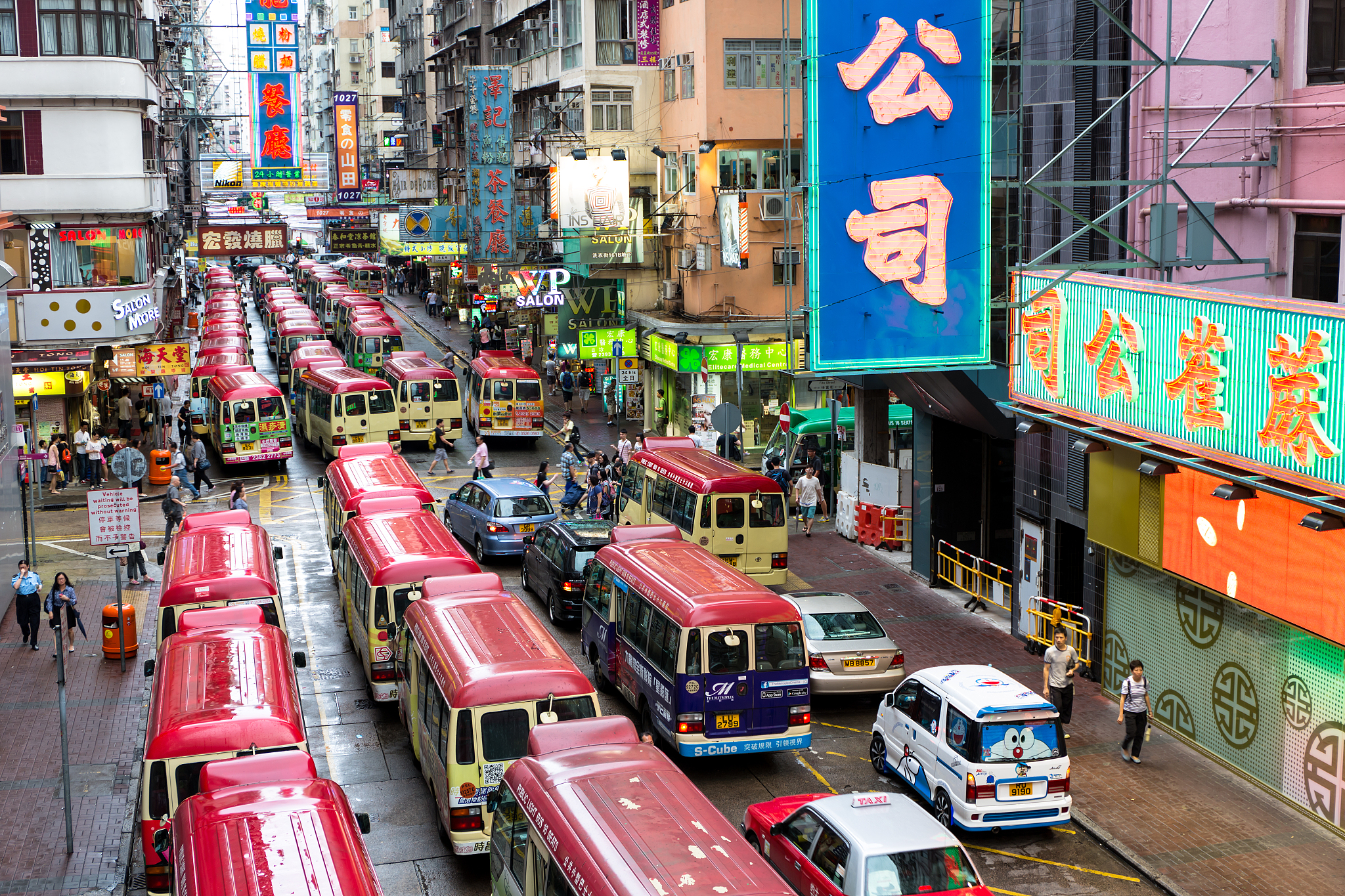 hong kong street, mini bus and signs everywhere