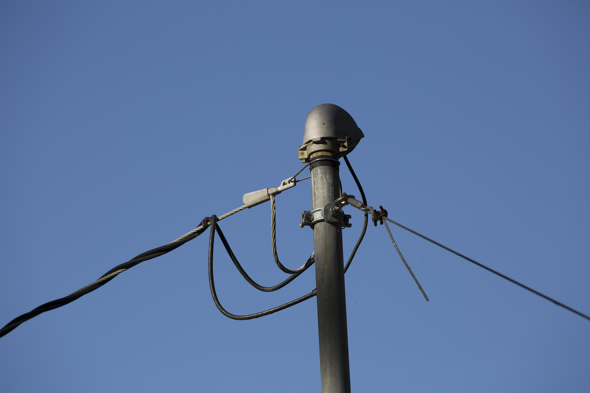 low angle view of telephone line pole against clear sky