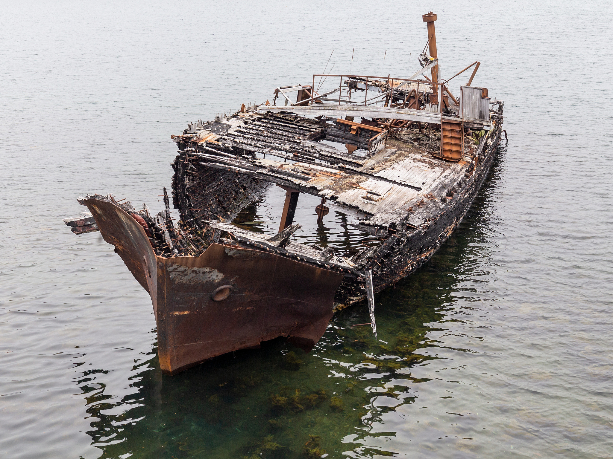 abandoned ship on a water of sea, a symbol of decadence and degr