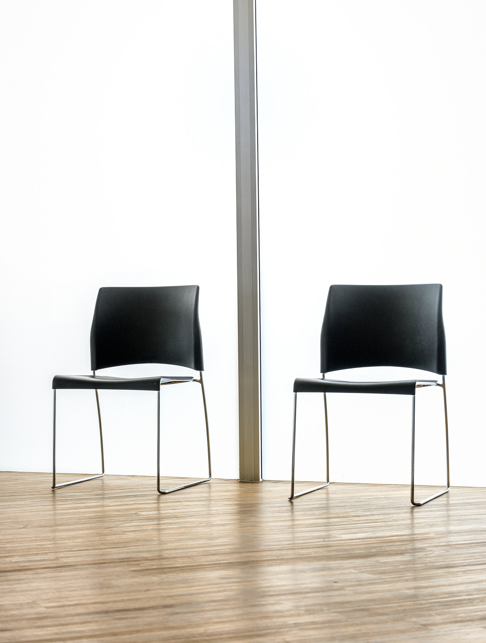 empty waiting room in office with two chairs