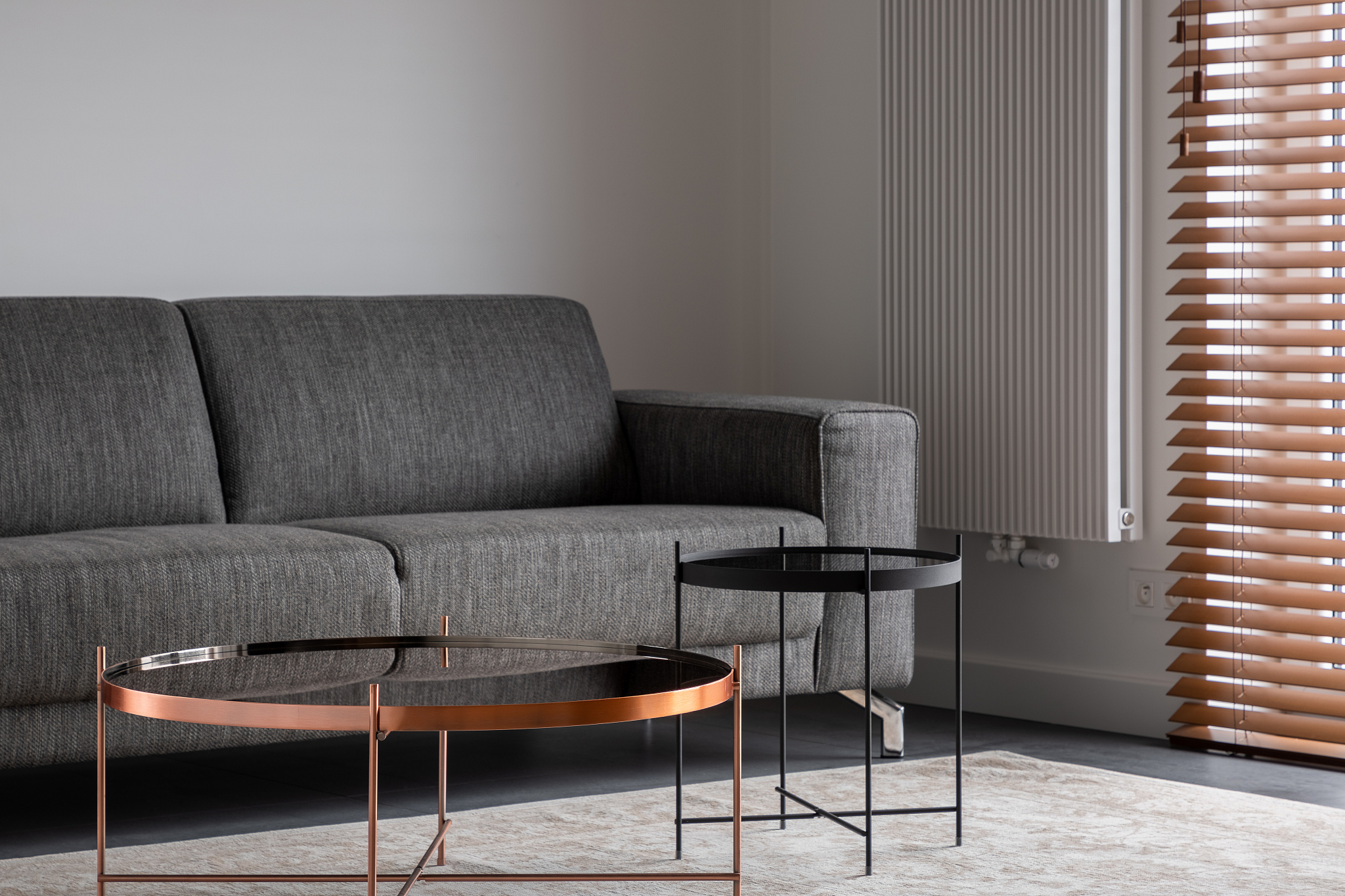 gray couch and metal tables