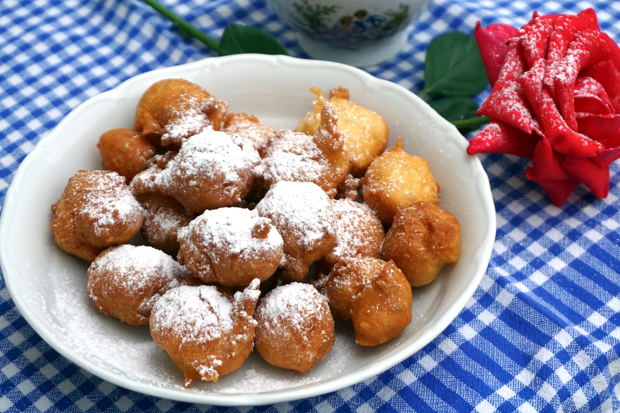 sweet fritter balls powdered with icing sugar