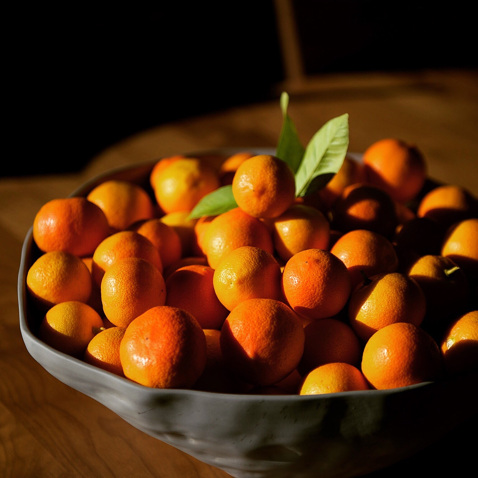 oranges in bowl on table