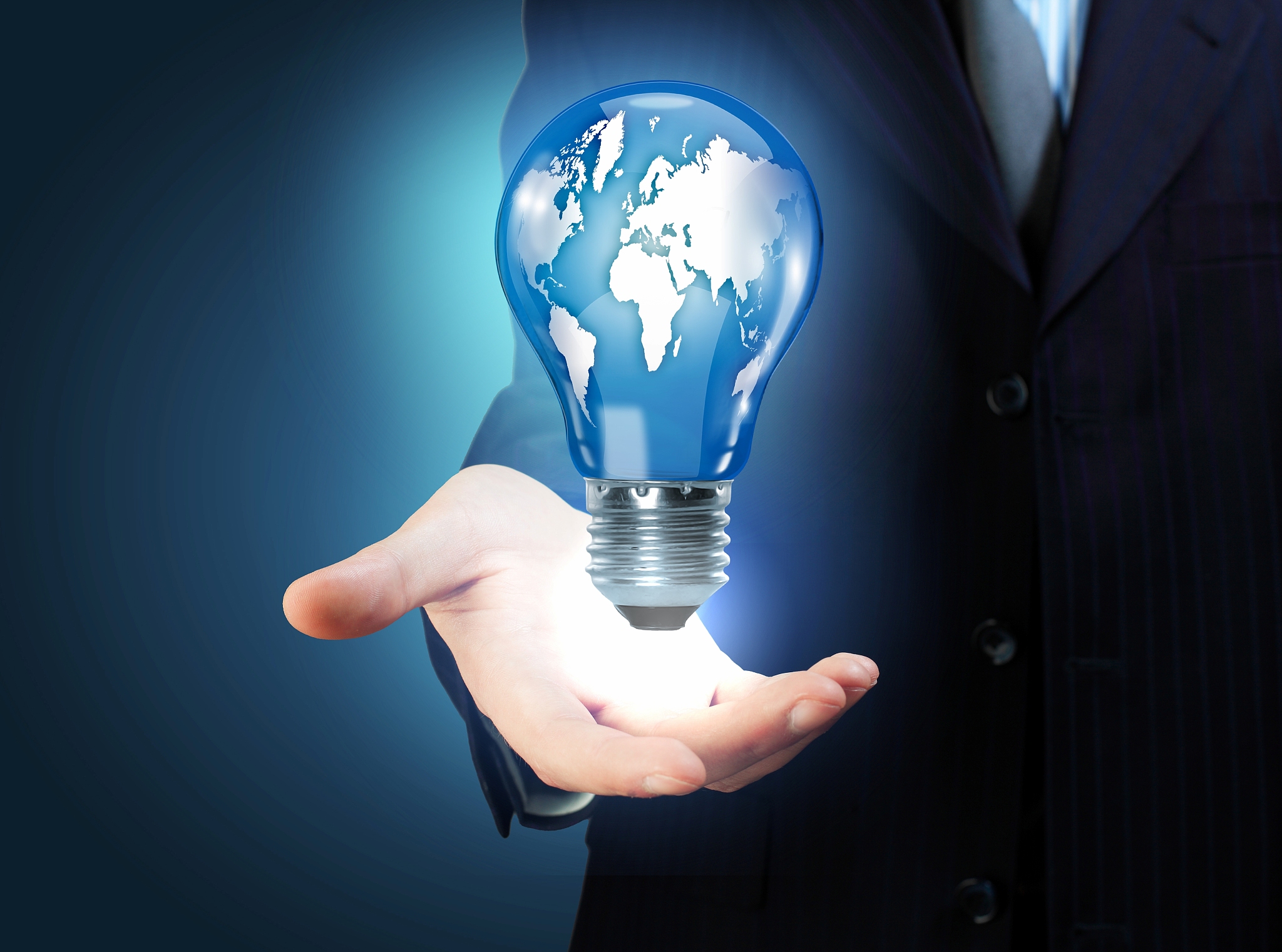 hand with lamp and hands of a business person