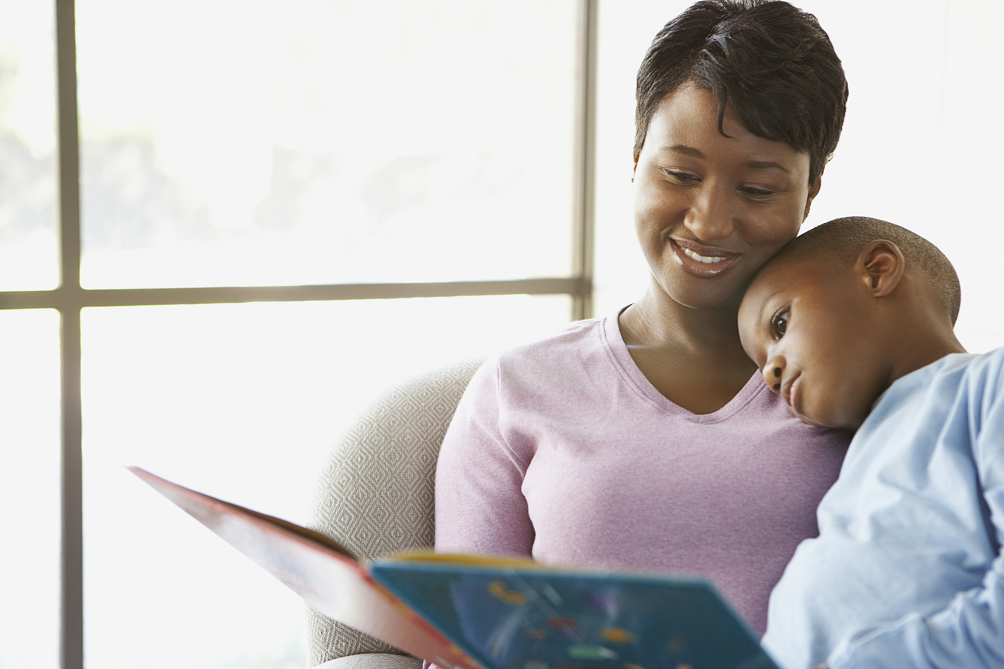 mother reading a story to her son