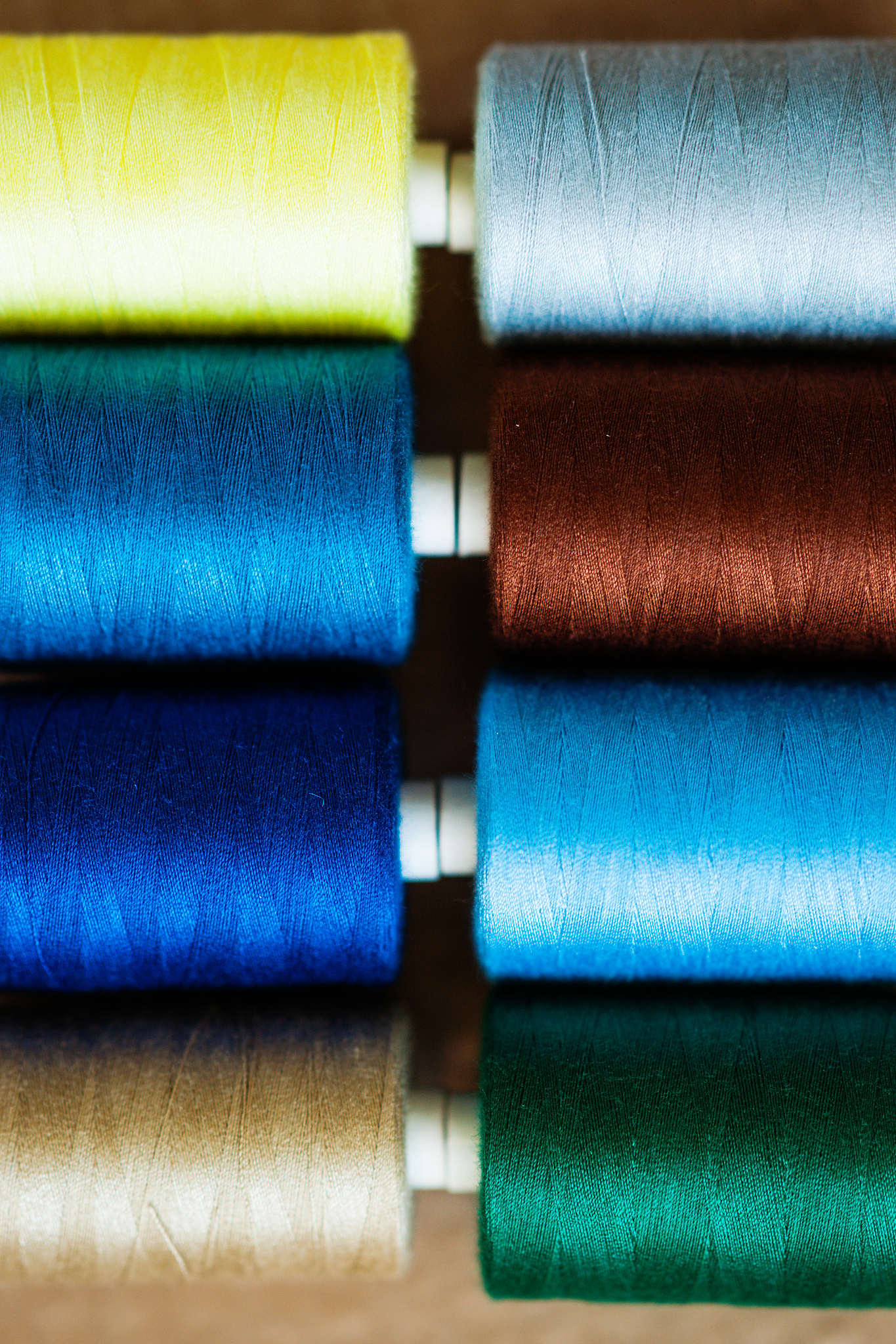 pile of colorful spools of thread