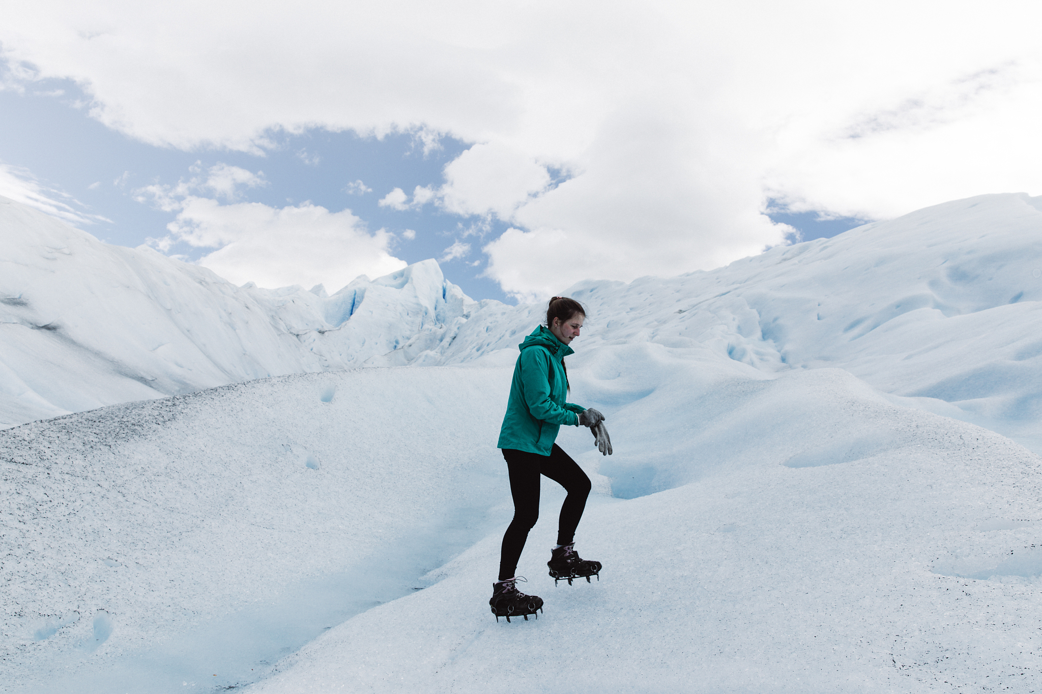 woman hiking on perito moreno glacier