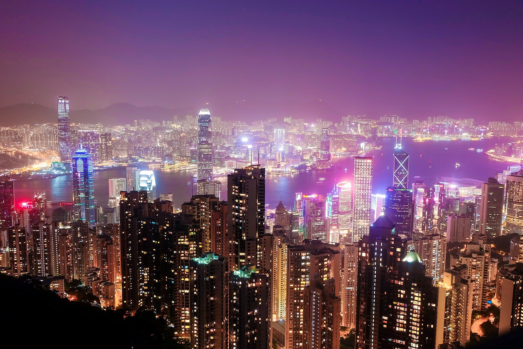 illuminated cityscape against sky at night