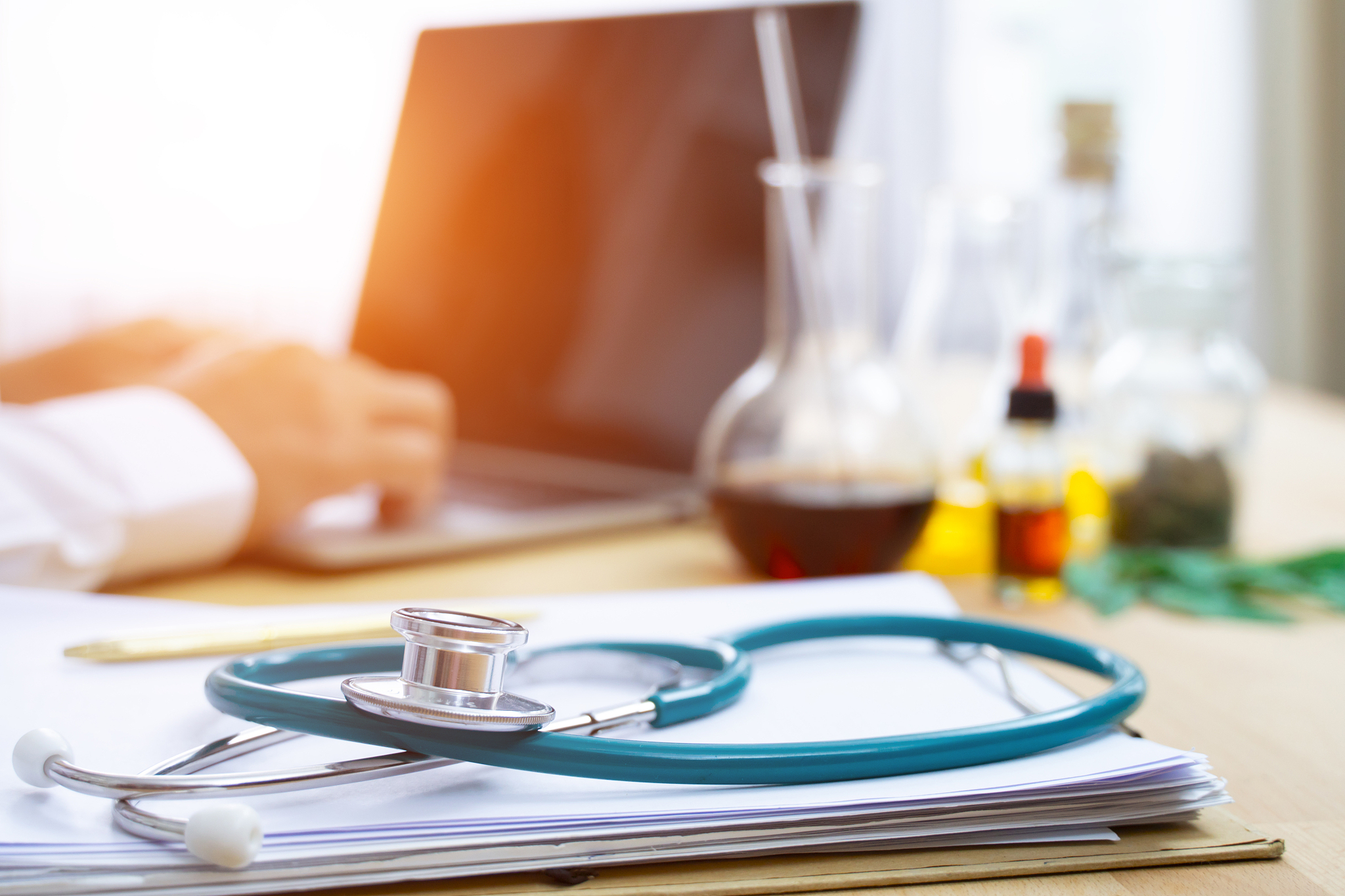 stethoscope with clipboard and laptop on desk,doctor working in 