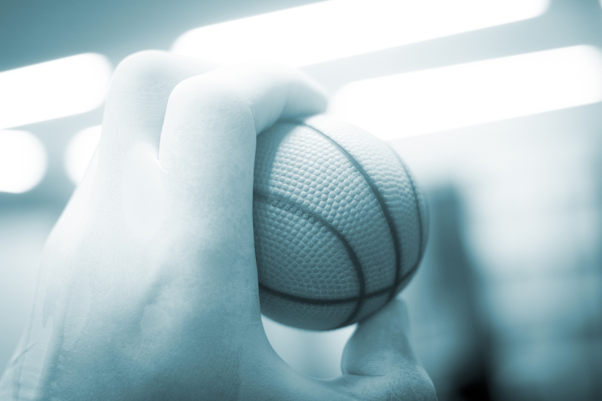 close-up of hand holding ball